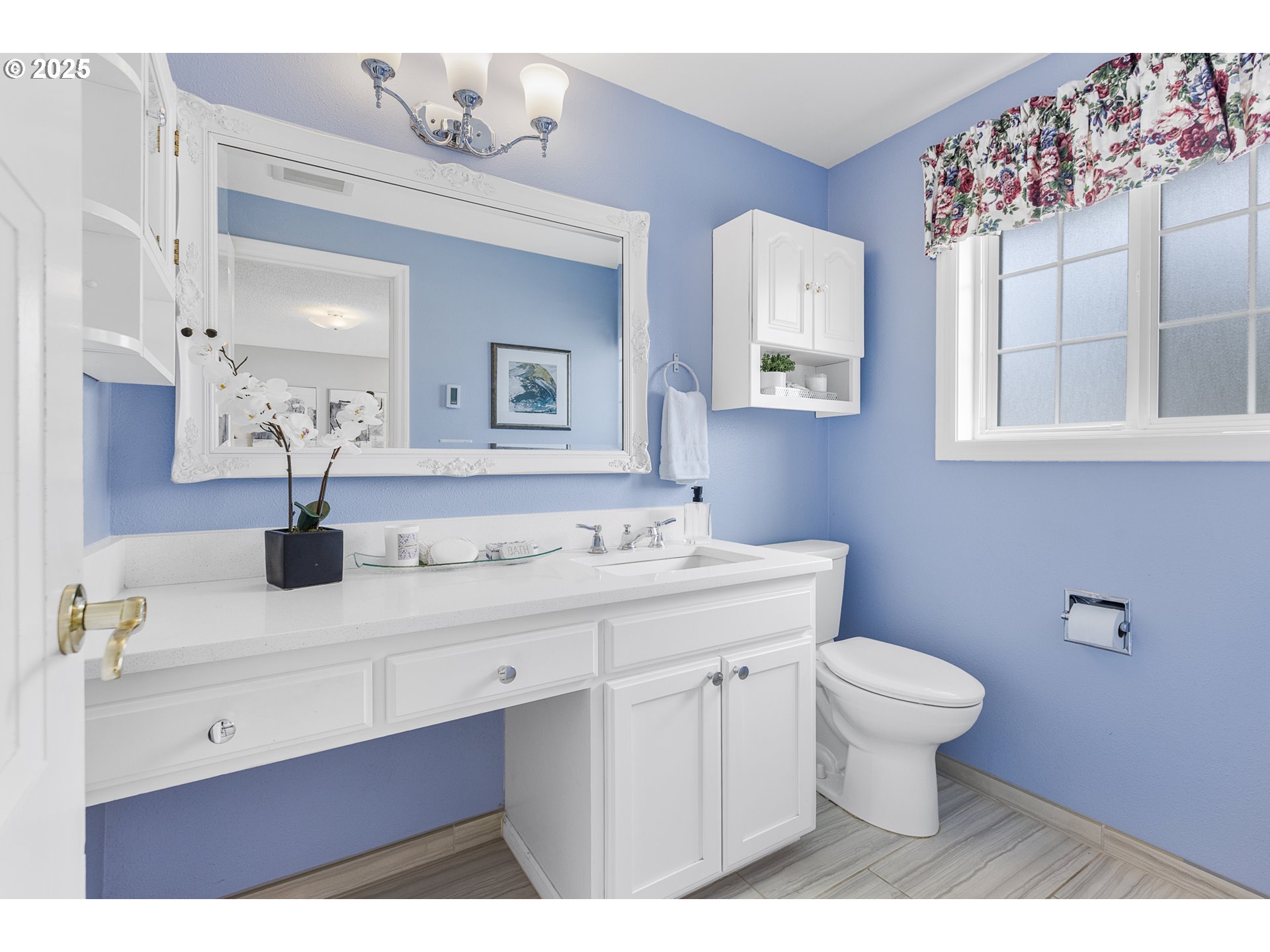 2055 Ridgeway Drive Eugene, OR 97401 - Photo 11 of 48 a bathroom with a sink a toilet and mirror