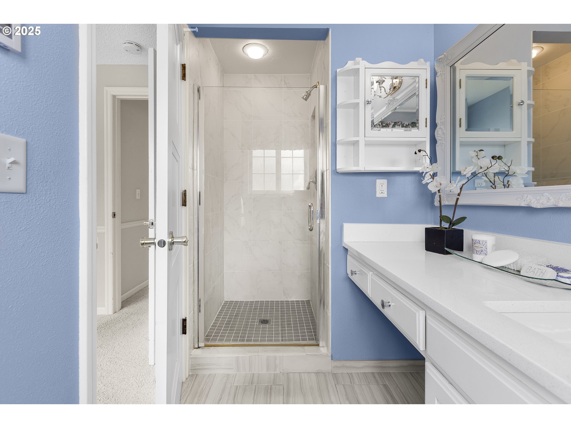 2055 Ridgeway Drive Eugene, OR 97401 - Photo 12 of 48 a bathroom with a sink and a mirror