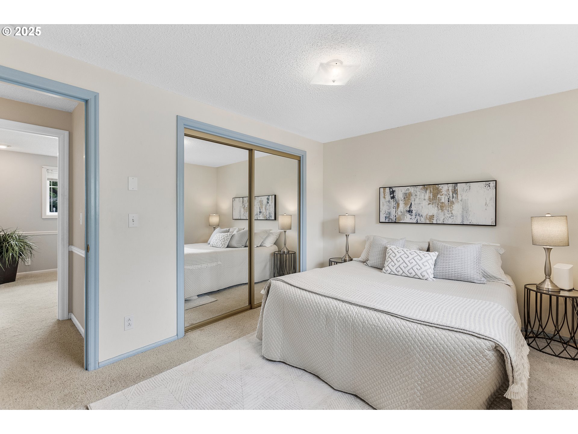 2055 Ridgeway Drive Eugene, OR 97401 - Photo 14 of 48 a bedroom with a bed and a lamp