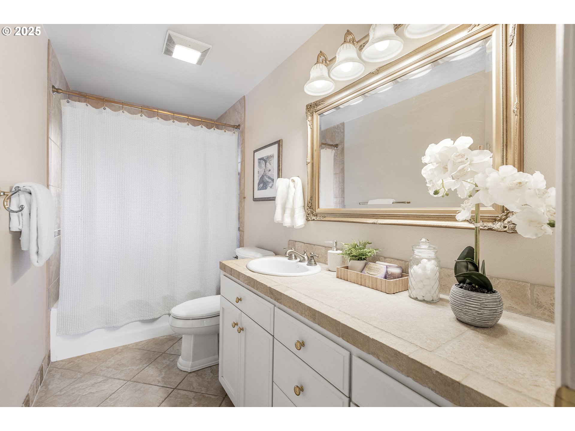 2055 Ridgeway Drive Eugene, OR 97401 - Photo 16 of 48 a bathroom with a granite countertop sink a toilet and a mirror