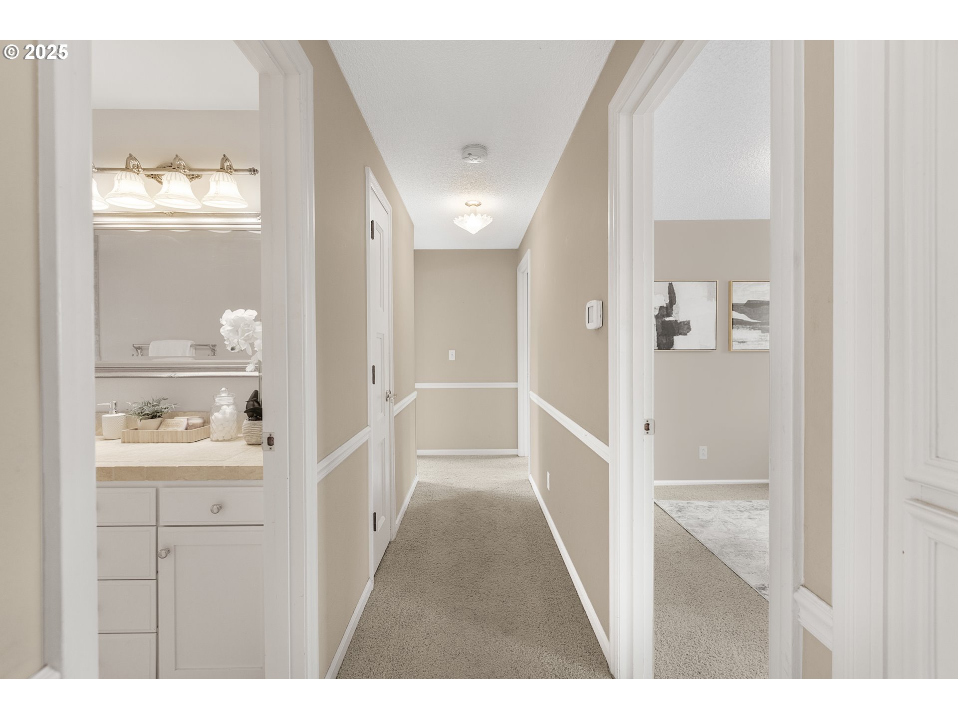 2055 Ridgeway Drive Eugene, OR 97401 - Photo 18 of 48 a view of a hallway with bathroom and mirror