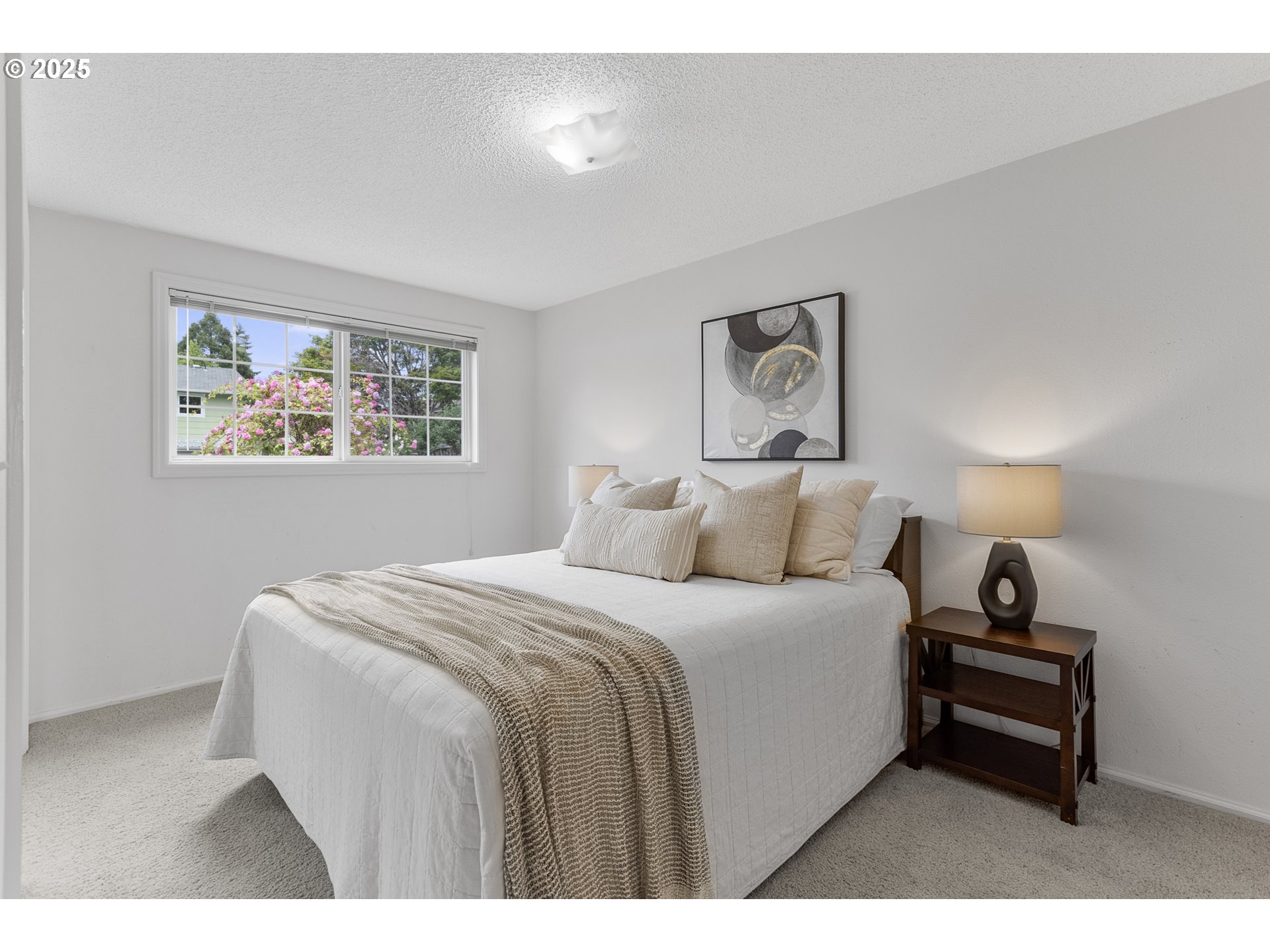 2055 Ridgeway Drive Eugene, OR 97401 - Photo 19 of 48 a bedroom with a bed and a painting on the wall