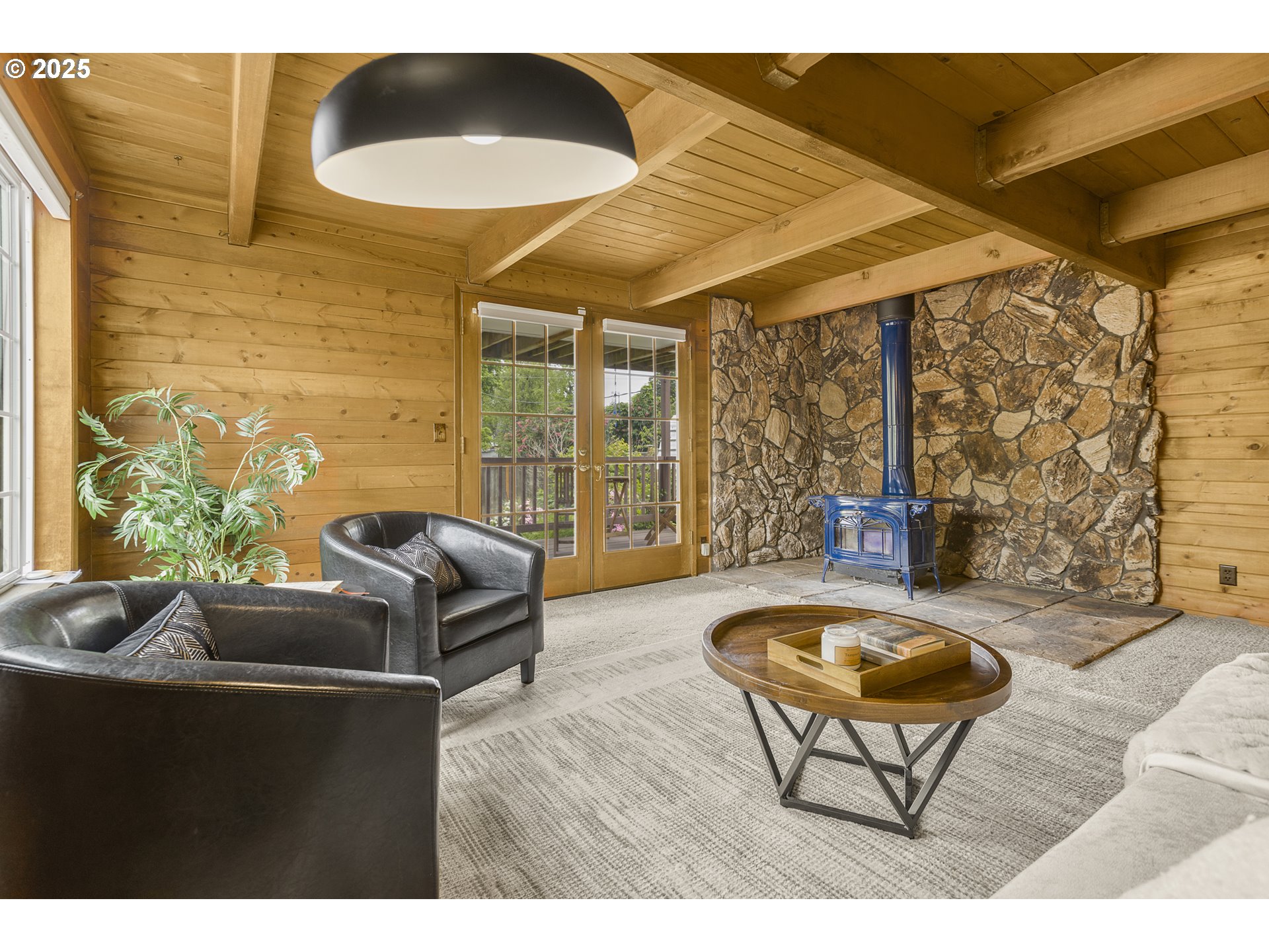 2055 Ridgeway Drive Eugene, OR 97401 - Photo 26 of 48 a living room with furniture and a floor to ceiling window