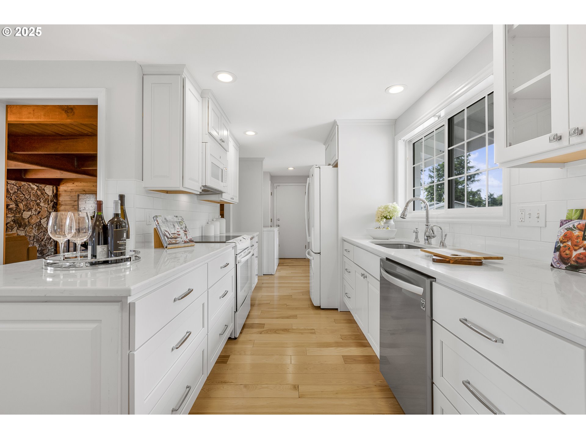 2055 Ridgeway Drive Eugene, OR 97401 - Photo 4 of 48 a large kitchen with stainless steel appliances kitchen island granite countertop a sink and cabinets