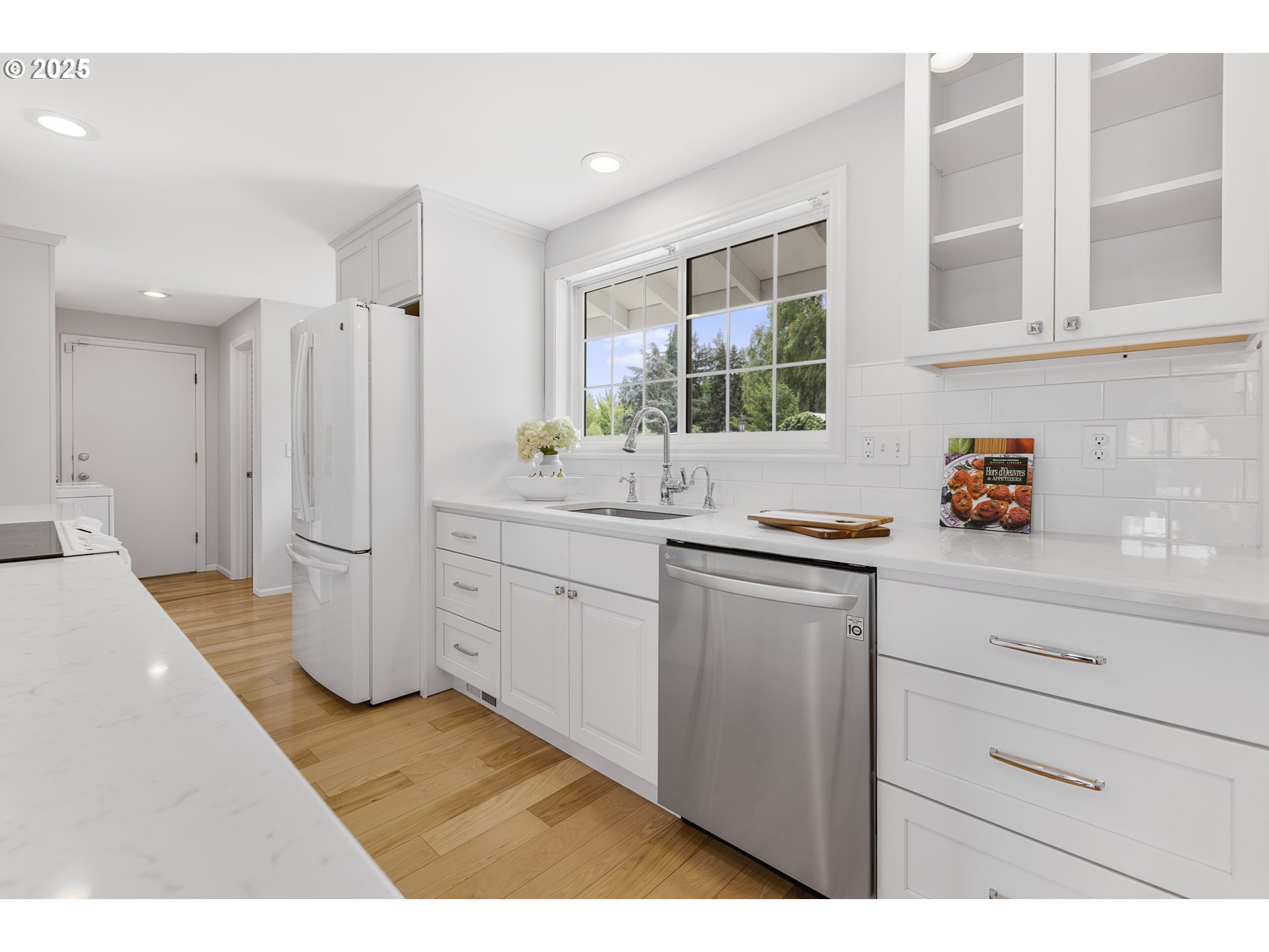 2055 Ridgeway Drive Eugene, OR 97401 - Photo 5 of 48 a kitchen with a sink and refrigerator