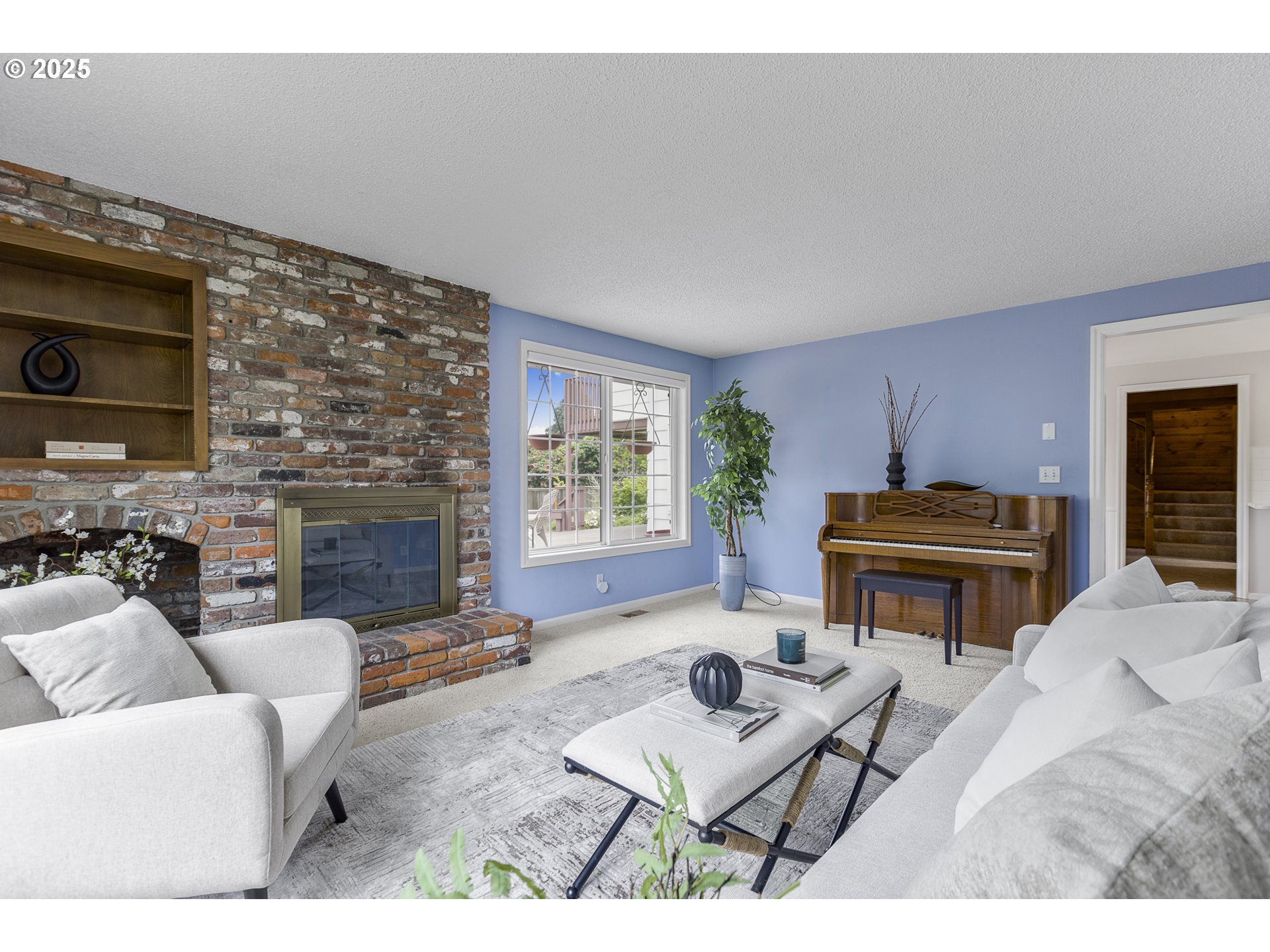 2055 Ridgeway Drive Eugene, OR 97401 - Photo 8 of 48 a living room with furniture a fireplace and a flat screen tv