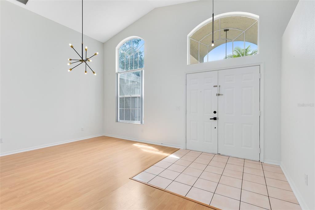 5809 Donnelly Circle Orlando, FL 32821 - Photo 3 of 22 a view of an entryway with wooden floor