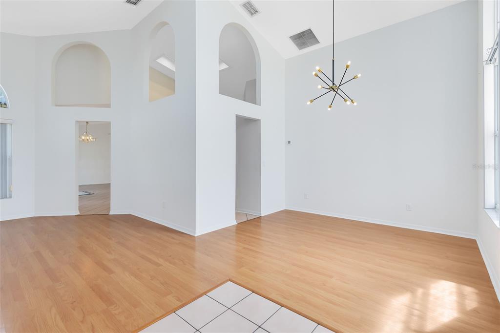 5809 Donnelly Circle Orlando, FL 32821 - Photo 4 of 22 a view of a big room with closet and chandelier fan