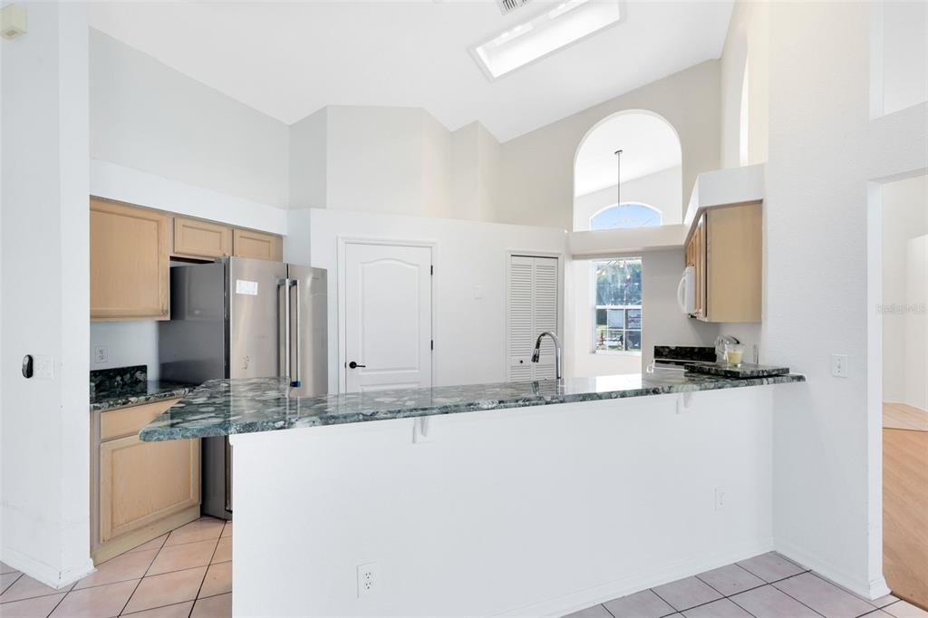5809 Donnelly Circle Orlando, FL 32821 - Photo 9 of 22 a bathroom with a granite countertop sink and a mirror