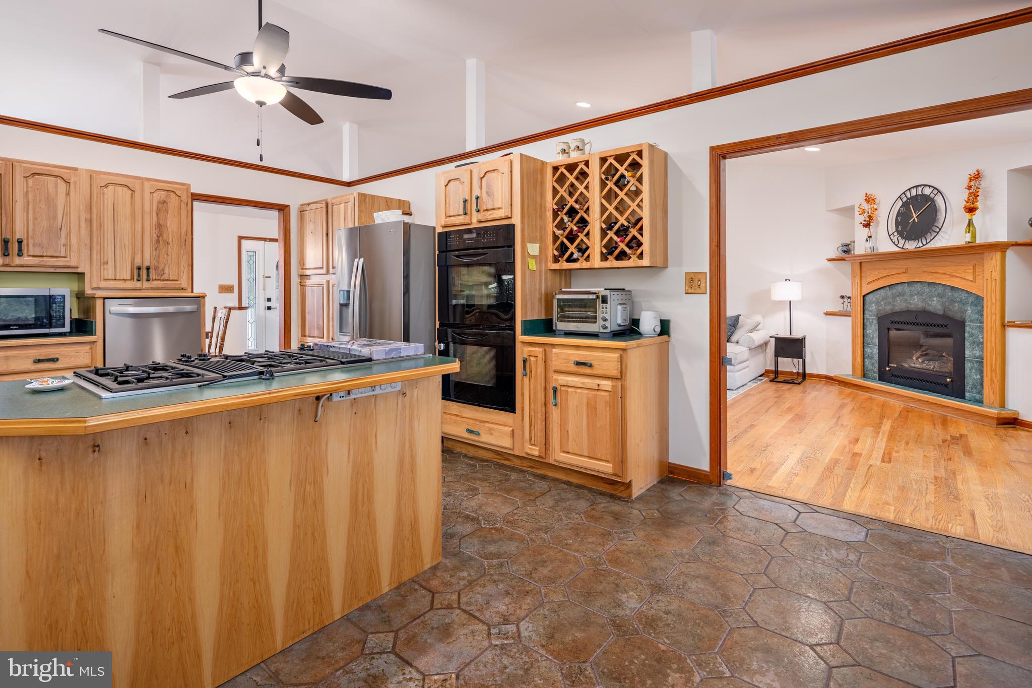 15902 Trenton Road Upperco, MD 21155 - Photo 18 of 57 a kitchen with stainless steel appliances granite countertop a refrigerator a stove and a sink with cabinets