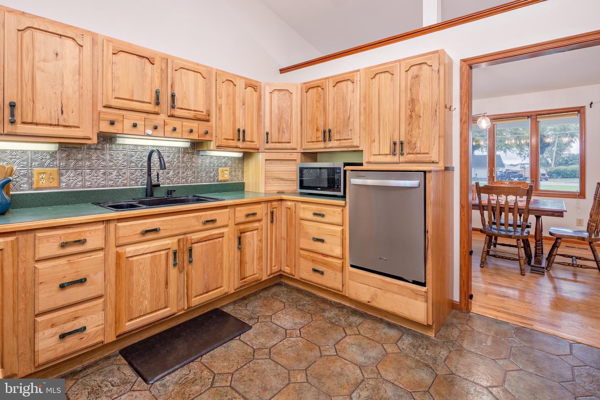 15902 Trenton Road Upperco, MD 21155 - Photo 19 of 57 a kitchen with granite countertop white cabinets and white appliances