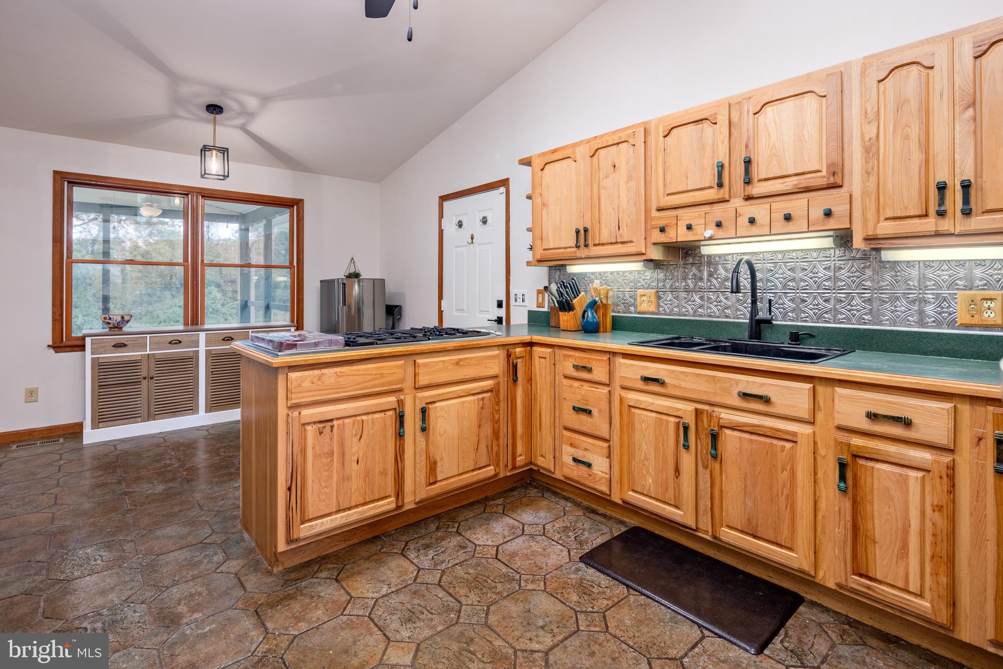 15902 Trenton Road Upperco, MD 21155 - Photo 21 of 57 a kitchen with stainless steel appliances granite countertop a sink a stove and cabinets