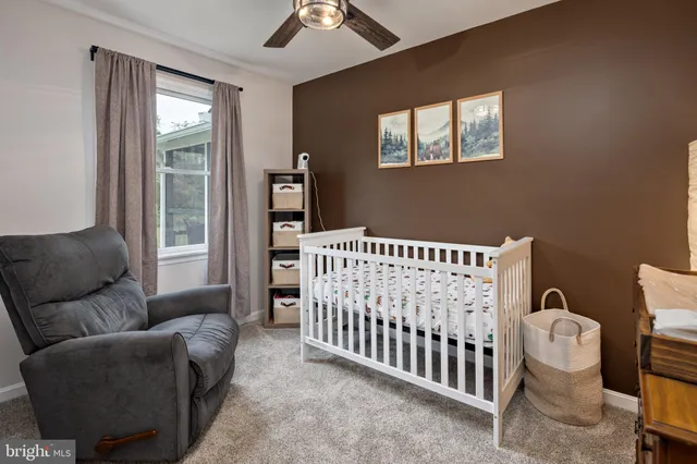 a view of living room filled with furniture and furniture