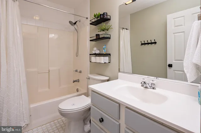 a living room with furniture a flat screen tv and outdoor view