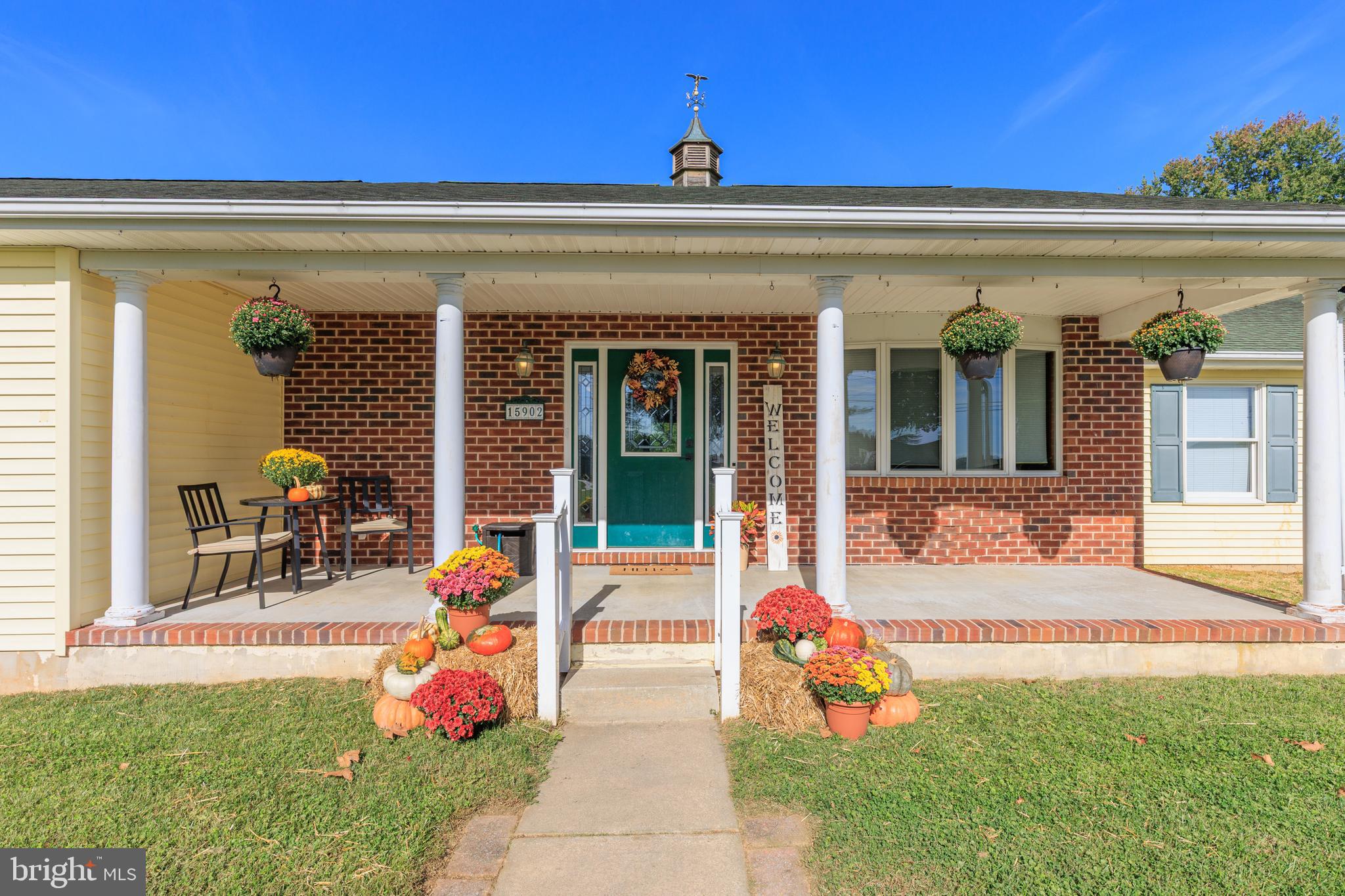 15902 Trenton Road Upperco, MD 21155 - Photo 4 of 57 a front view of a house with outdoor seating and yard