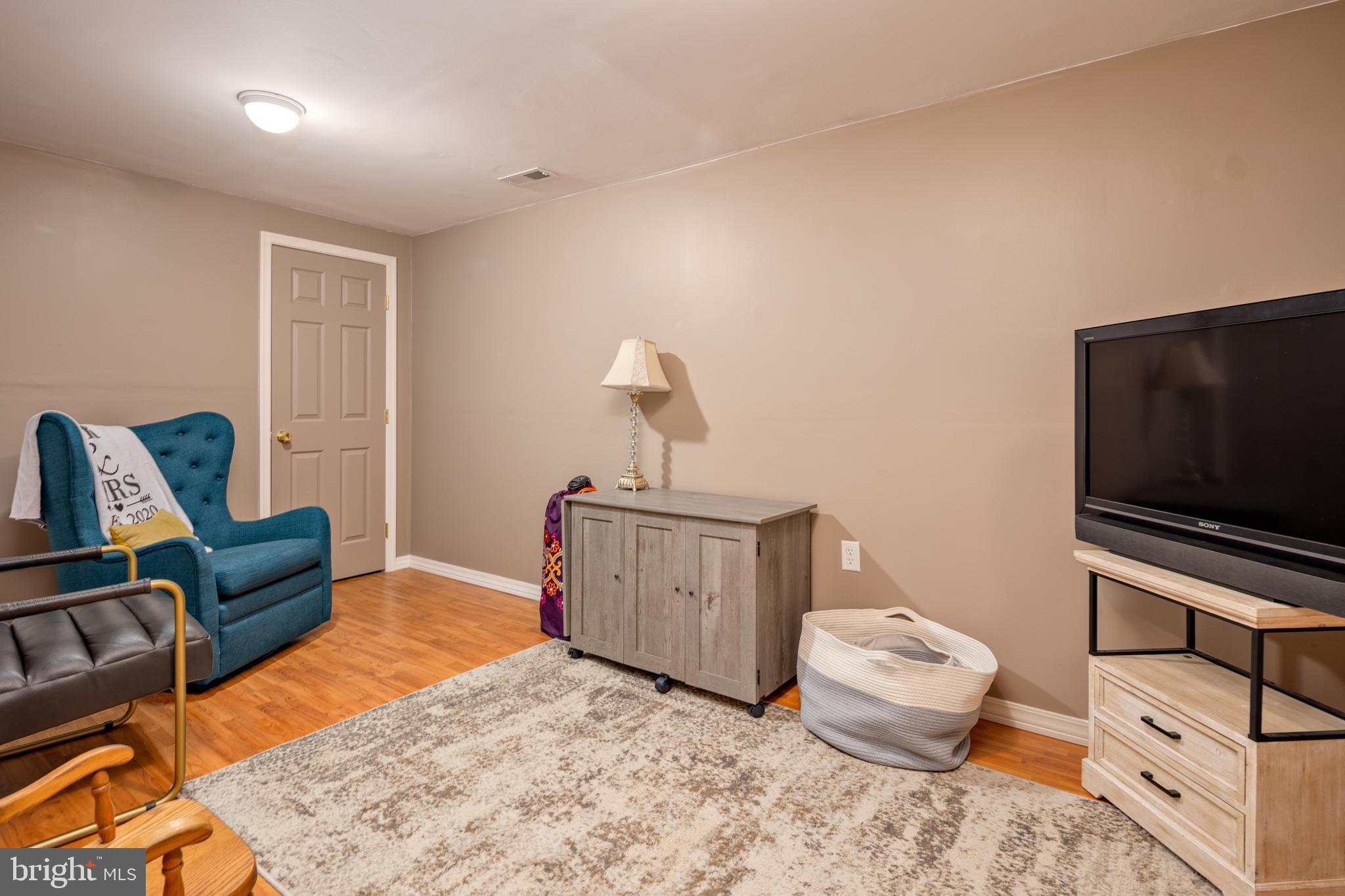 15902 Trenton Road Upperco, MD 21155 - Photo 42 of 57 a living room with furniture and a flat screen tv