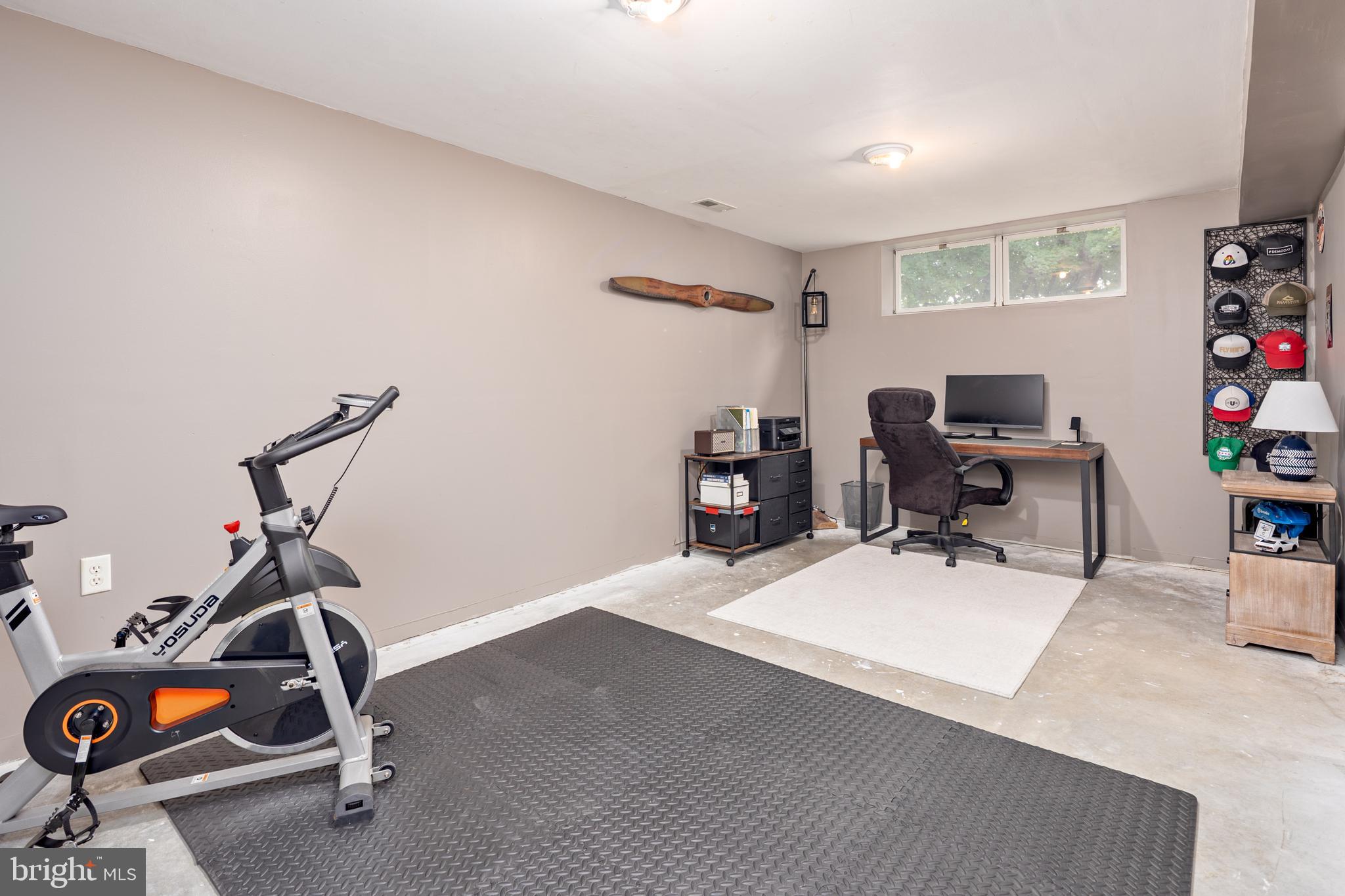 15902 Trenton Road Upperco, MD 21155 - Photo 43 of 57 a room with gym equipment and wooden floor