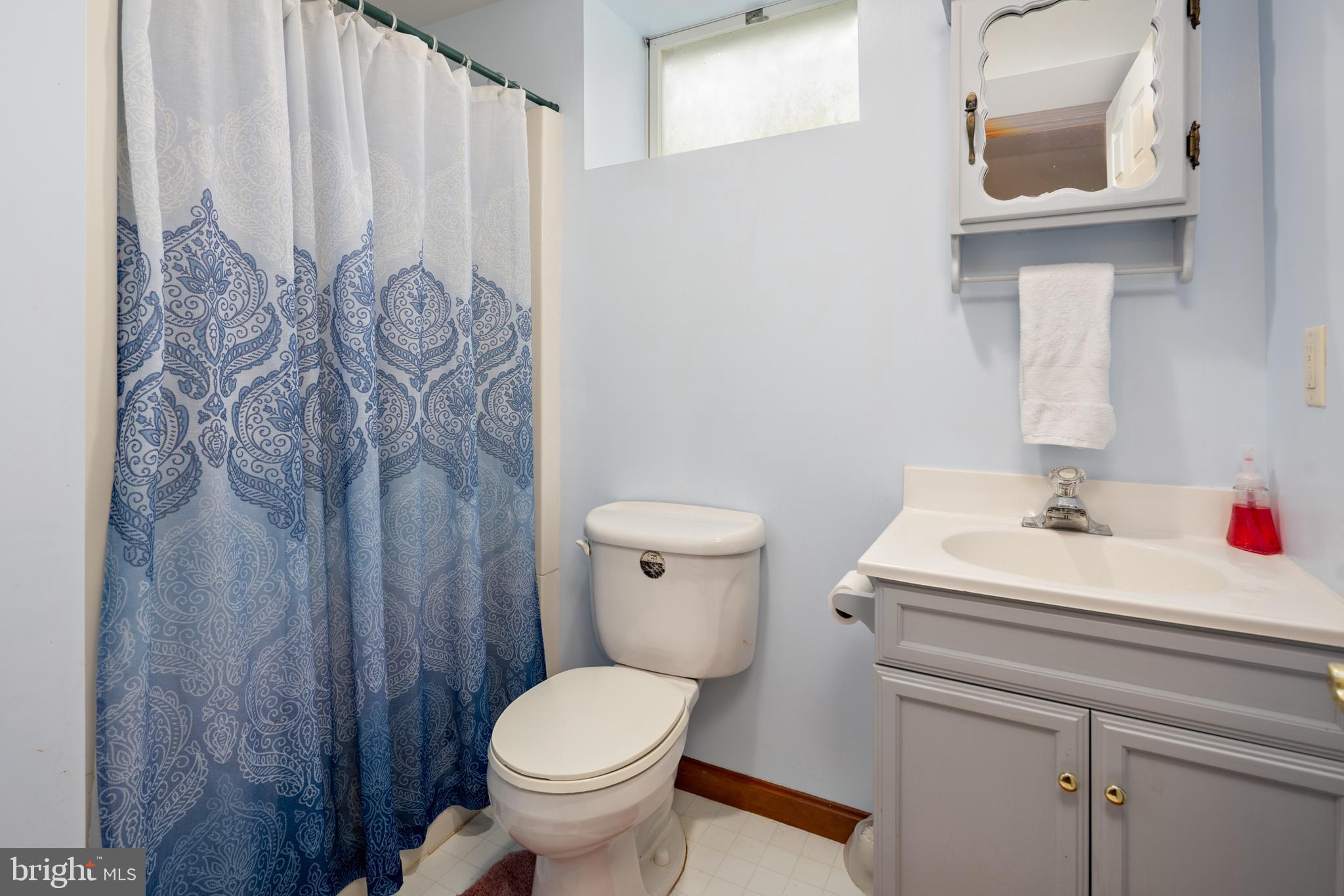 15902 Trenton Road Upperco, MD 21155 - Photo 45 of 57 a bathroom with a toilet sink and mirror