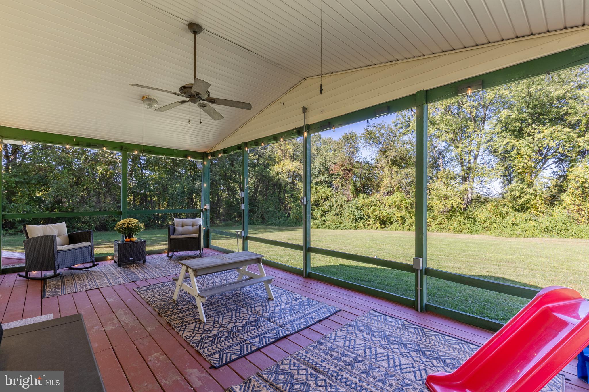 15902 Trenton Road Upperco, MD 21155 - Photo 10 of 57 a view of a porch with furniture and wooden floor