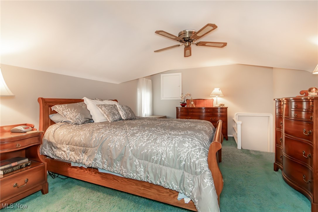 2110 Miami Road Euclid, OH 44117 - Photo 13 of 29 Bedroom featuring a ceiling fan, vaulted ceiling, and carpet