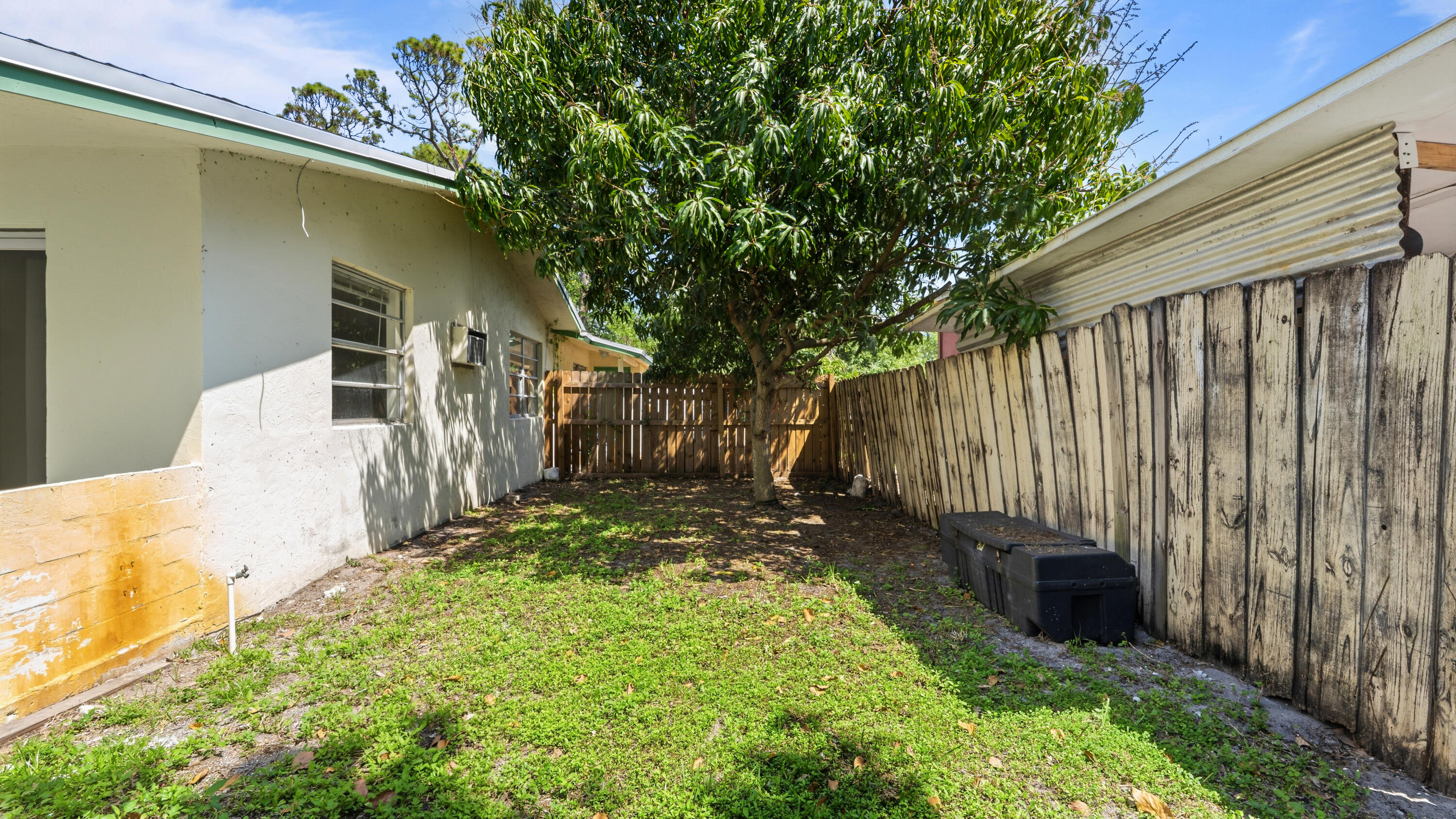 4453 Stevens Road Lake Worth Beach, FL 33461 - Photo 59 of 67 a view of a backyard with pathway