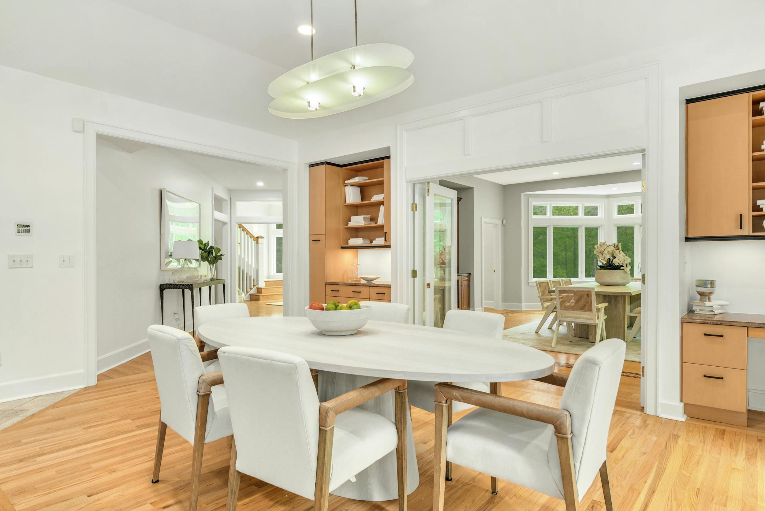 1315 Smith Ridge Road New Canaan, CT 06840 - Photo 12 of 54 a view of a dining room with furniture window and wooden floor