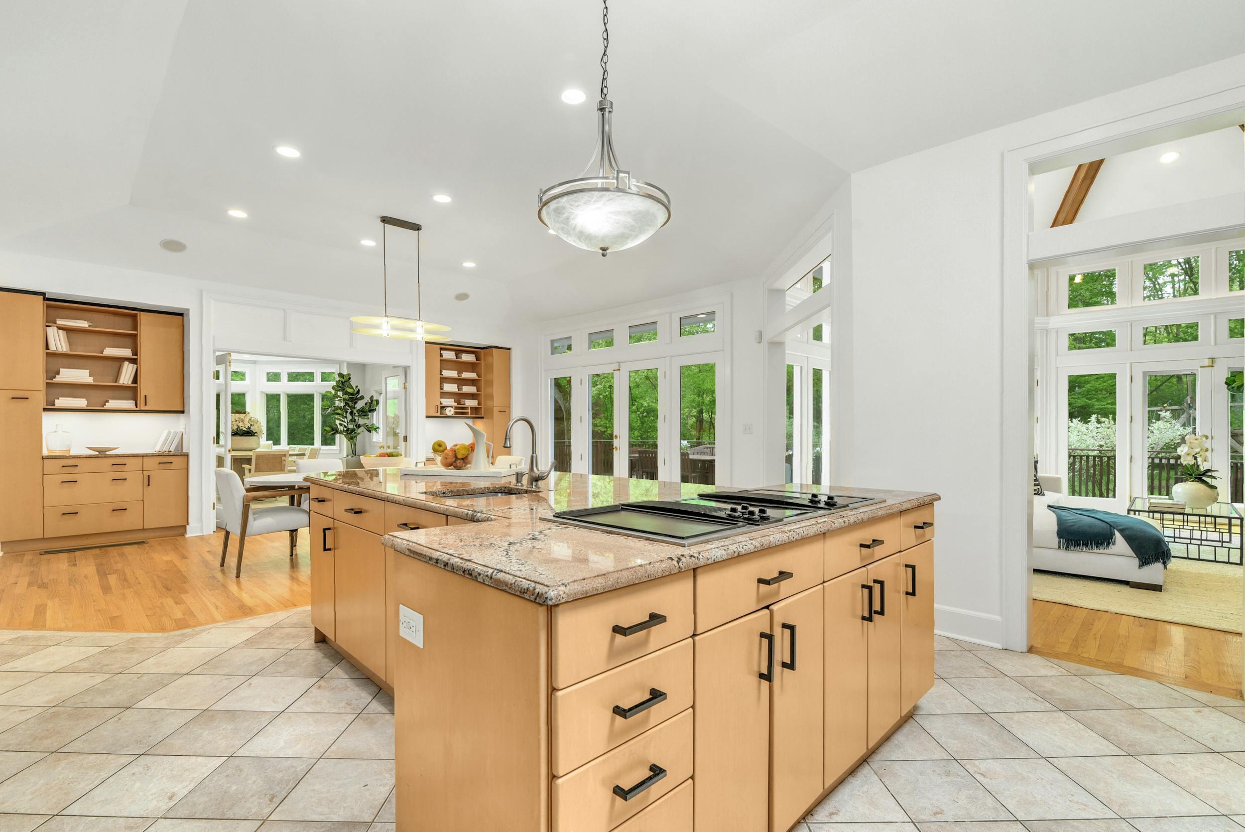 1315 Smith Ridge Road New Canaan, CT 06840 - Photo 14 of 54 a kitchen with stainless steel appliances granite countertop a stove and a wooden floors