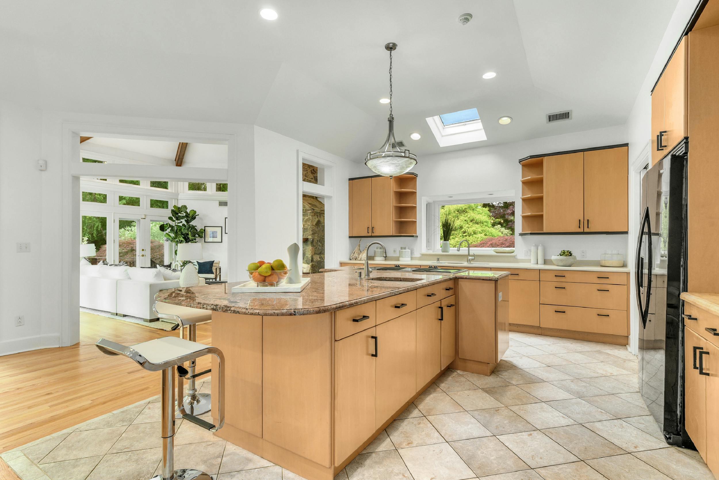 1315 Smith Ridge Road New Canaan, CT 06840 - Photo 15 of 54 a kitchen with stainless steel appliances kitchen island granite countertop a stove a sink and a refrigerator