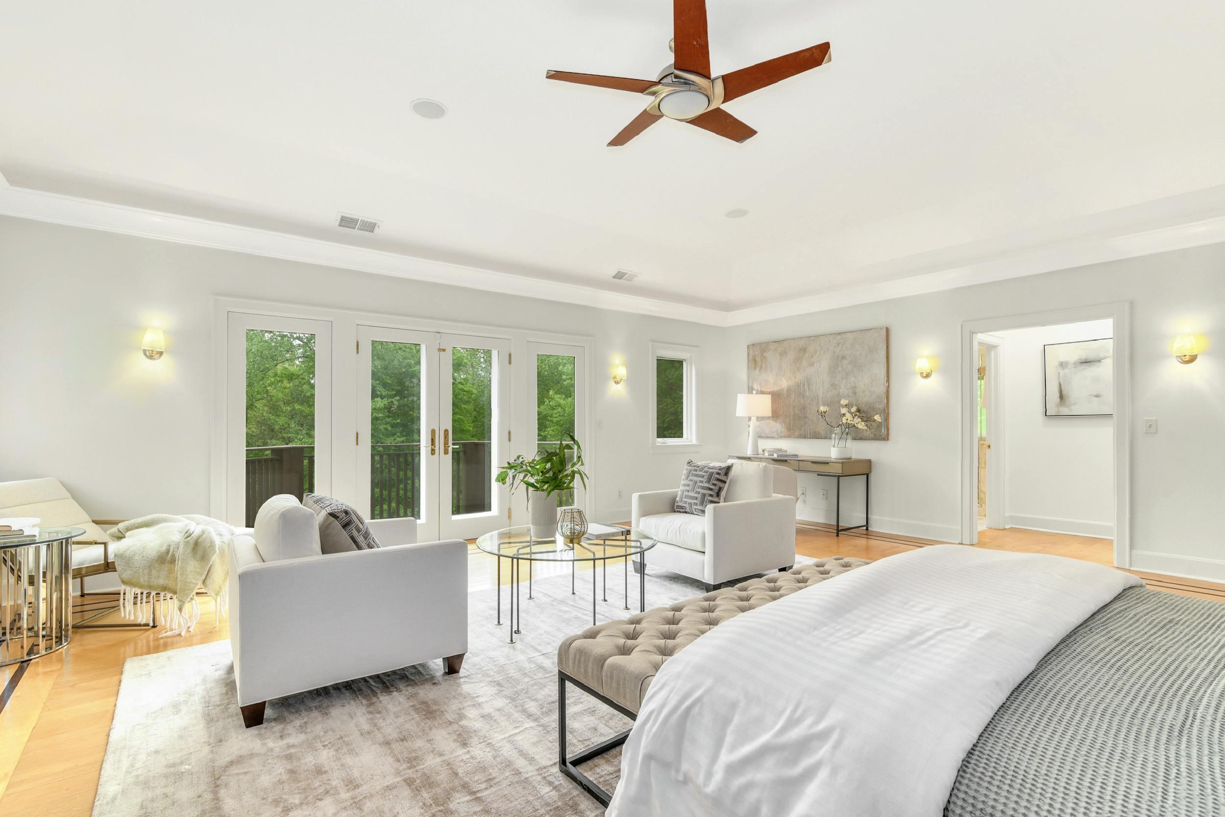 1315 Smith Ridge Road New Canaan, CT 06840 - Photo 20 of 54 a bedroom with a large bed couch and a window