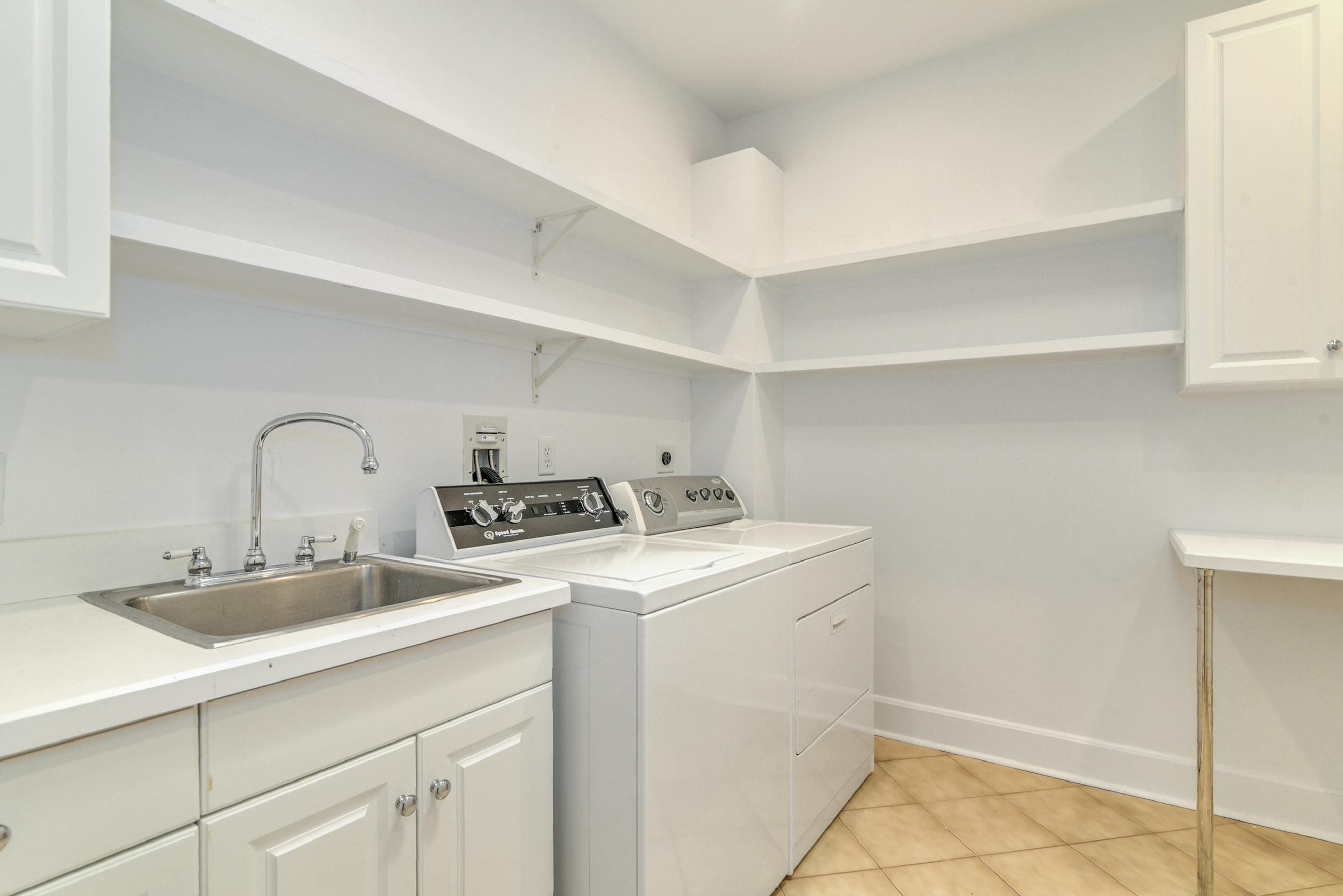 1315 Smith Ridge Road New Canaan, CT 06840 - Photo 26 of 54 a utility room with sink dryer and washer