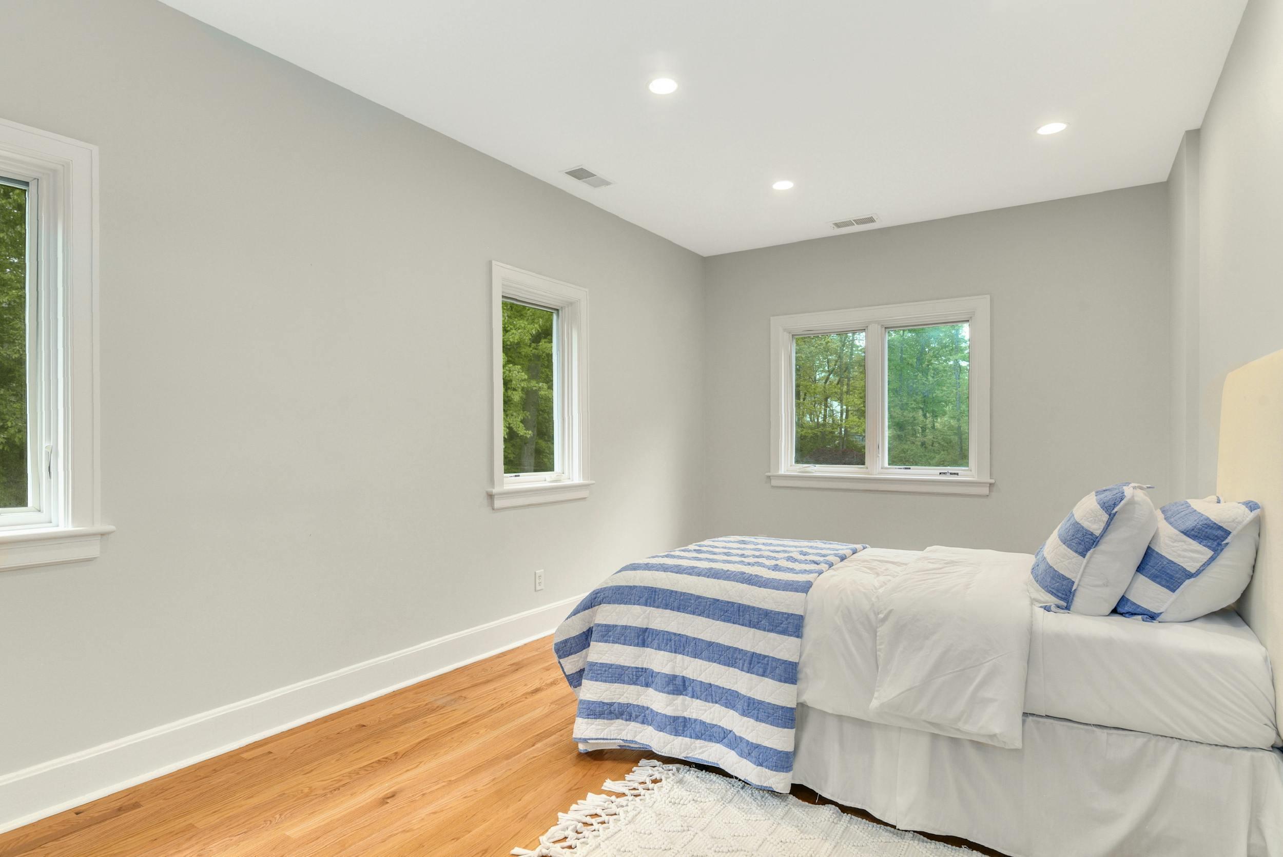 1315 Smith Ridge Road New Canaan, CT 06840 - Photo 27 of 54 a bedroom with a bed and a window