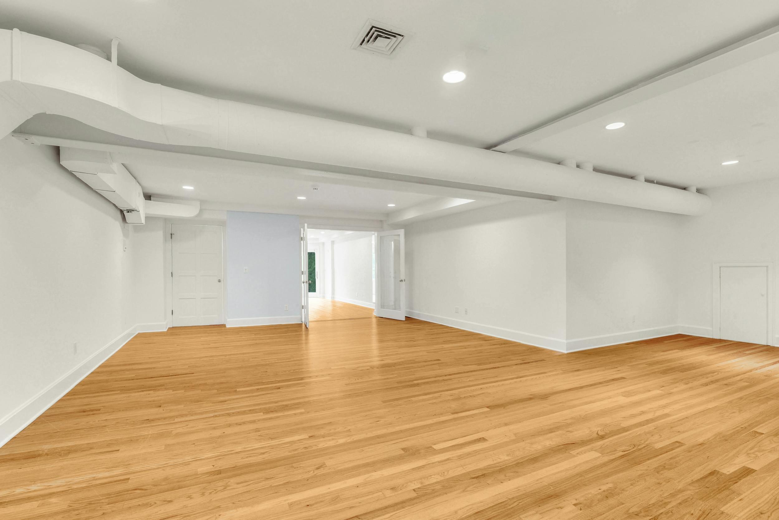 1315 Smith Ridge Road New Canaan, CT 06840 - Photo 32 of 54 a view of an empty room with wooden floor