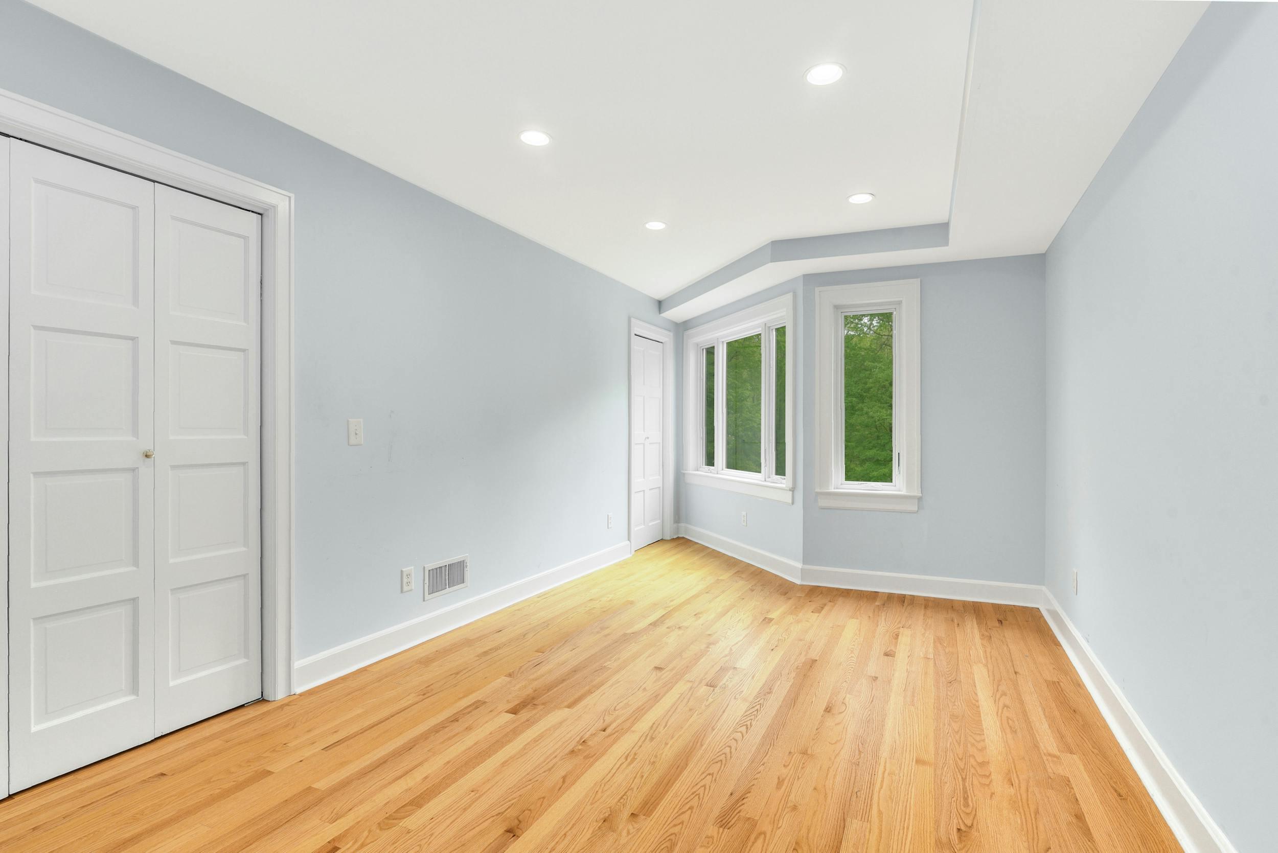 1315 Smith Ridge Road New Canaan, CT 06840 - Photo 39 of 54 a view of an empty room with wooden floor and a window