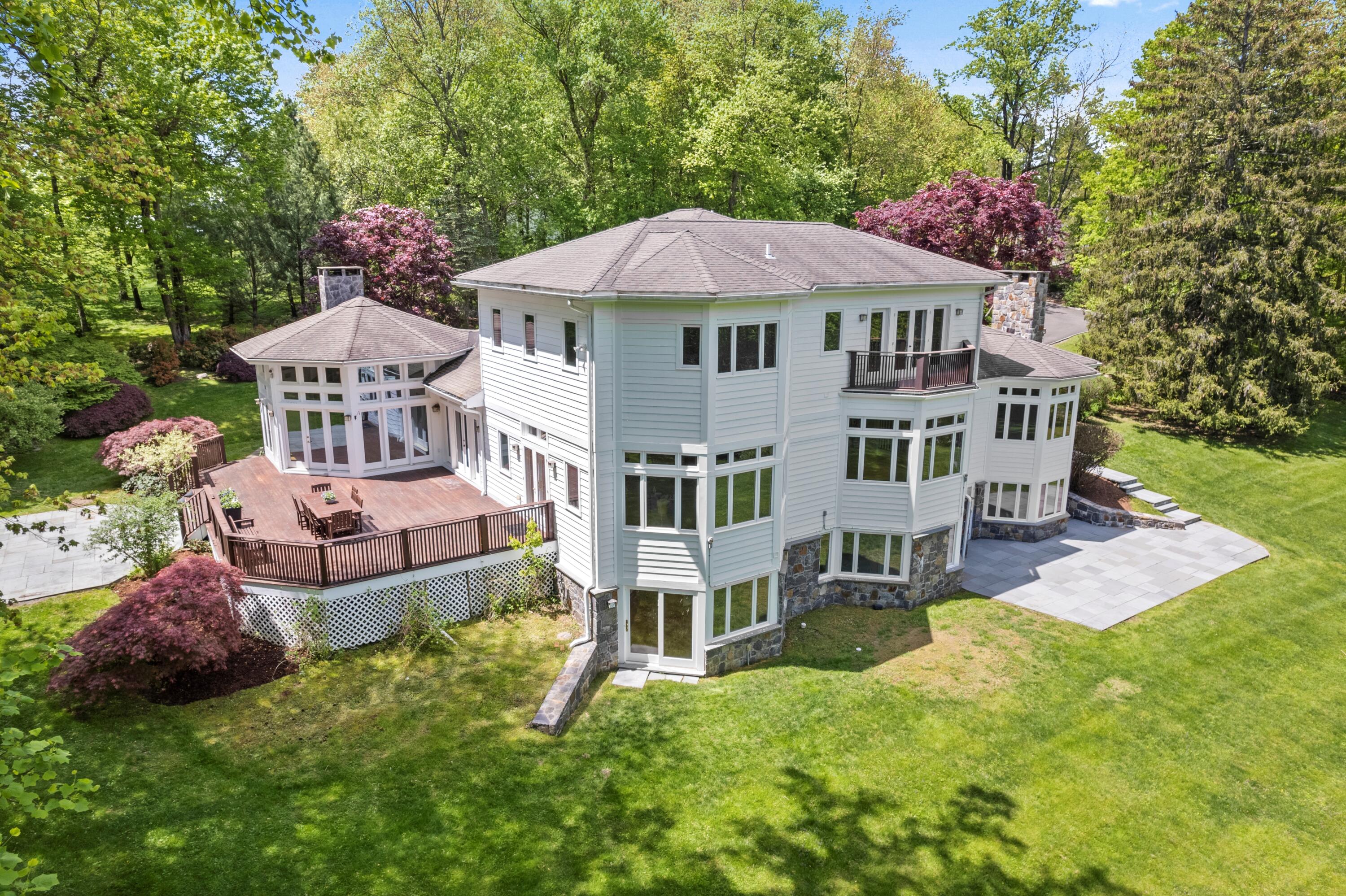 1315 Smith Ridge Road New Canaan, CT 06840 - Photo 48 of 54 a front view of a house with garden
