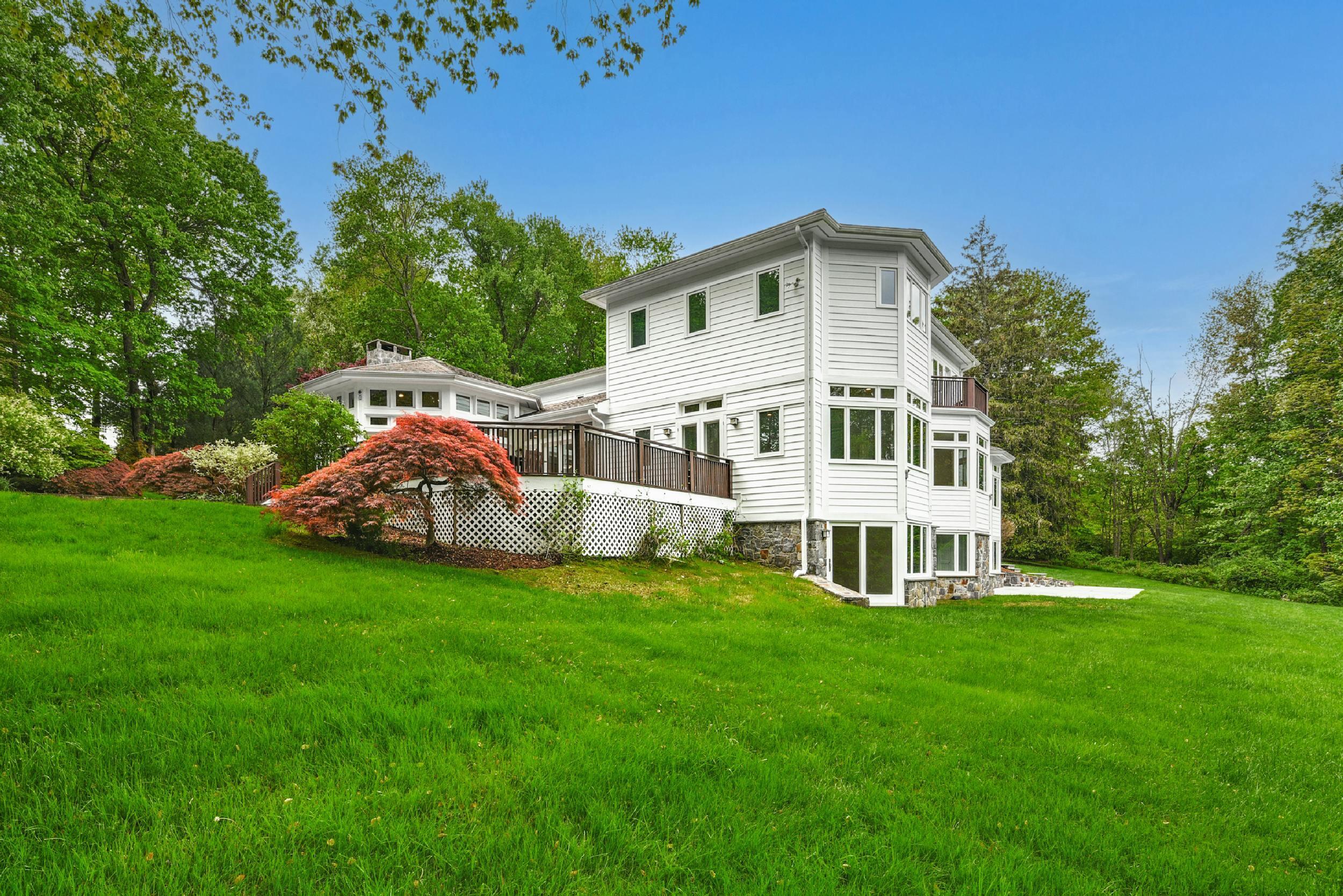 1315 Smith Ridge Road New Canaan, CT 06840 - Photo 52 of 54 a view of a house with a yard and sitting area