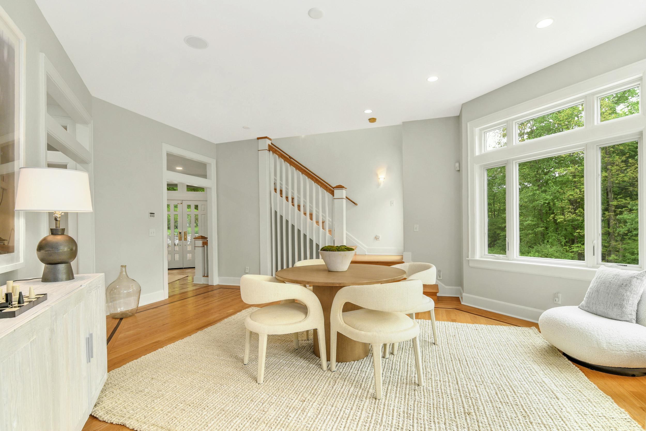 1315 Smith Ridge Road New Canaan, CT 06840 - Photo 9 of 54 a dining room with furniture and a large window