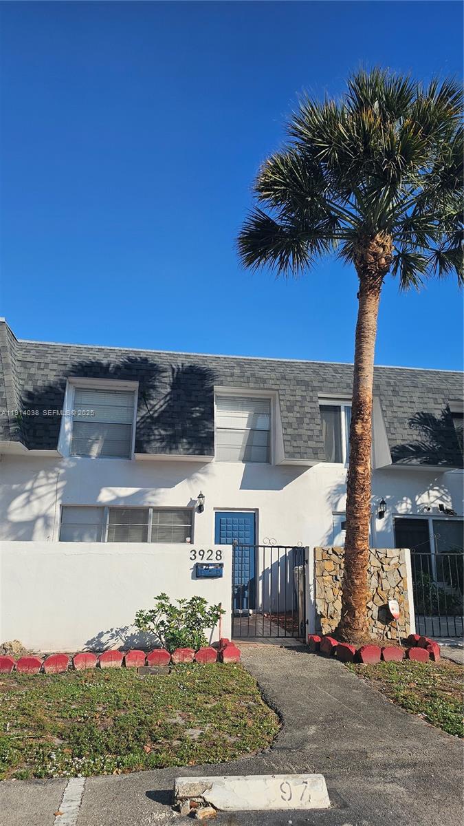 a view of a street with a house