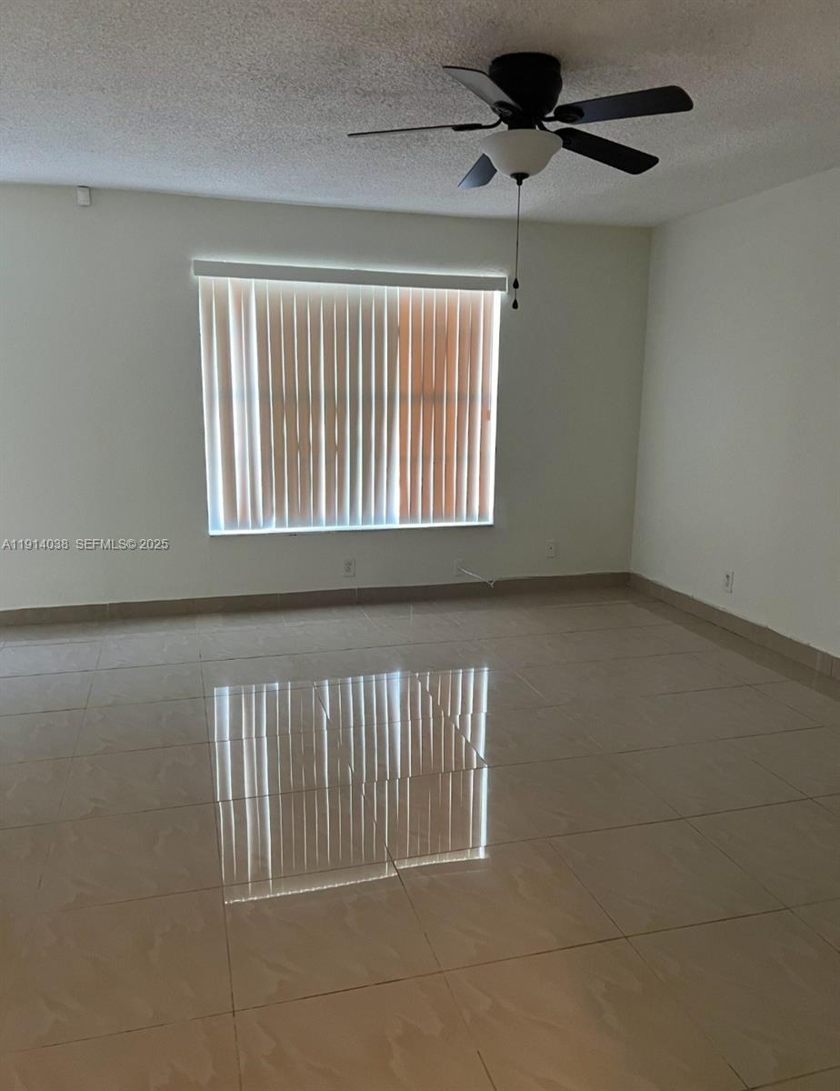 3928 Southwest 67th Way, Unit 97 Davie, FL 33314 - Photo 9 of 9 a view of an empty room with a window