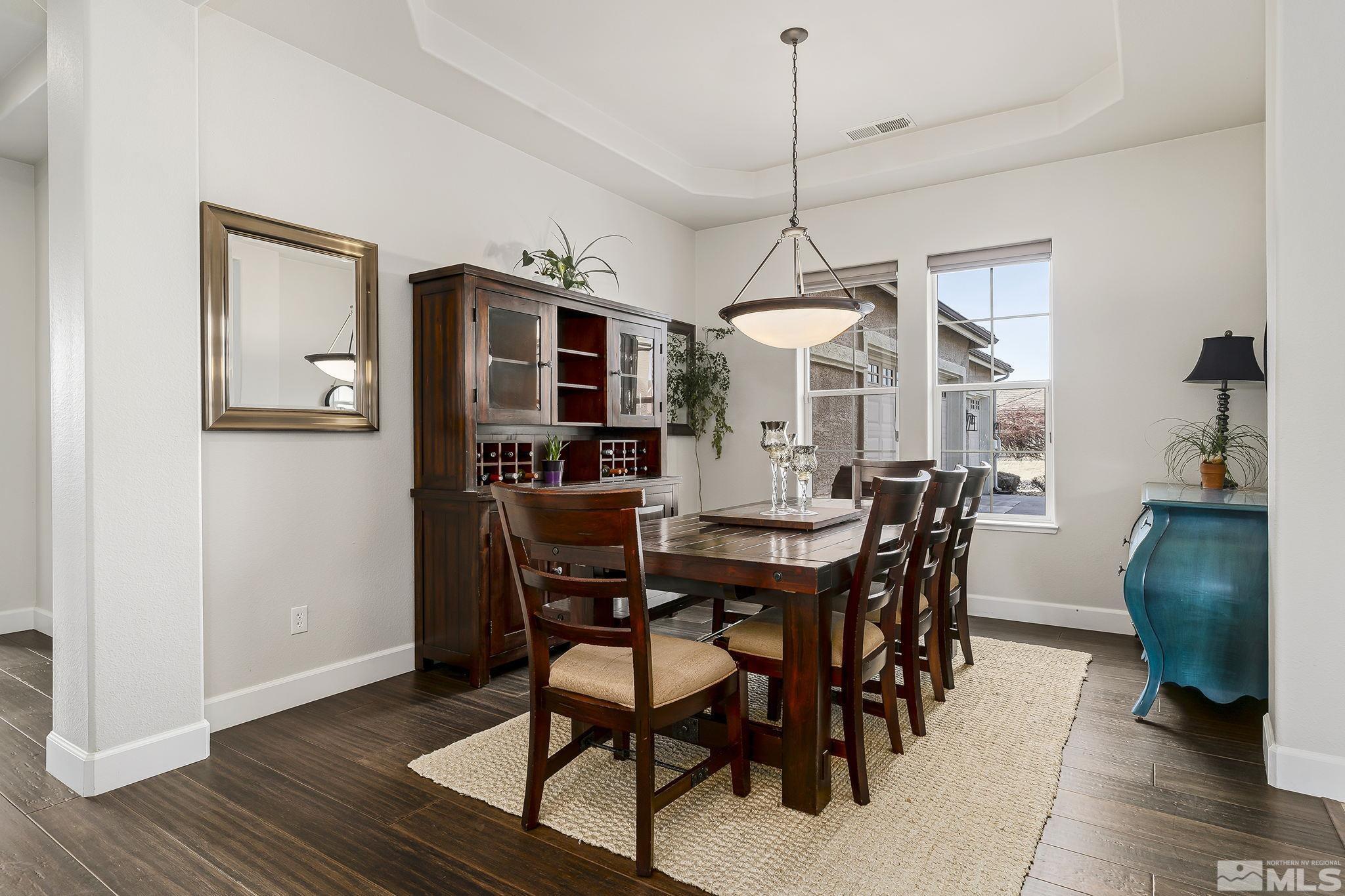 3528 Desert Fox Drive Sparks, NV 89436 - Photo 11 of 35 a view of a dining room with furniture and wooden floor
