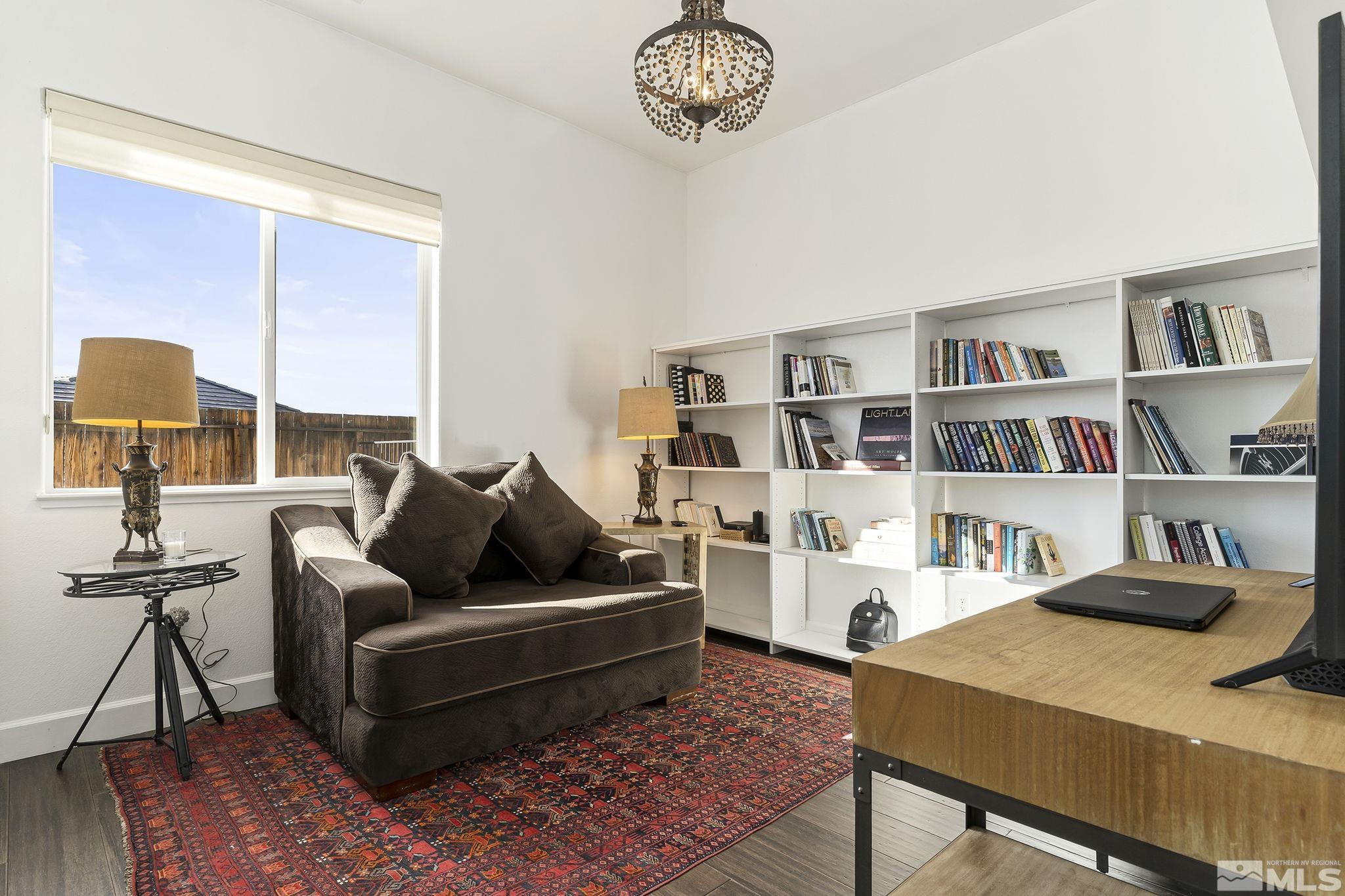 3528 Desert Fox Drive Sparks, NV 89436 - Photo 19 of 35 a living room with furniture and a book shelf