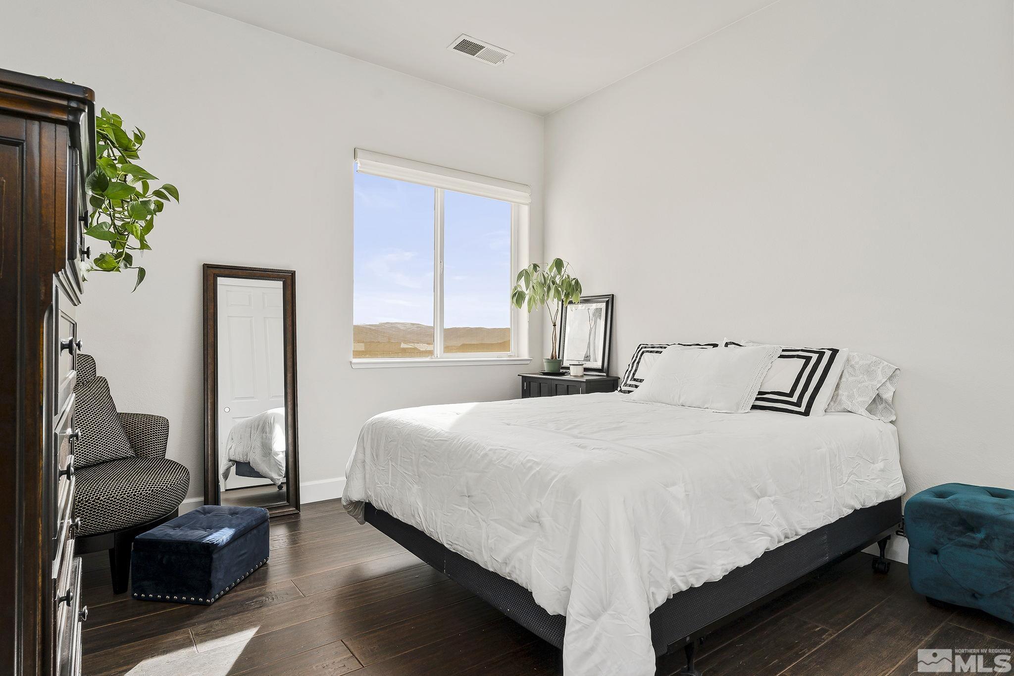 3528 Desert Fox Drive Sparks, NV 89436 - Photo 20 of 35 a bedroom with a bed table chair and a window