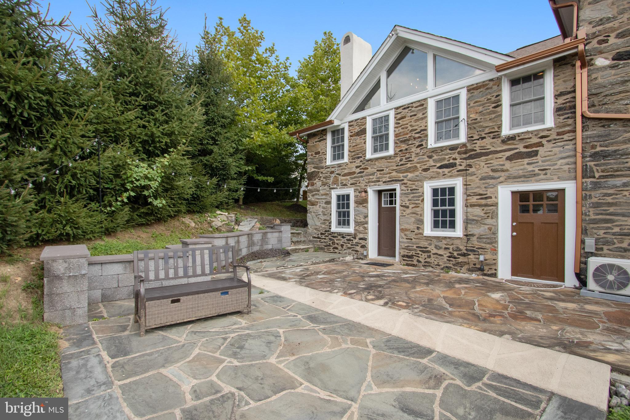 300 Ravenscliff Drive Springfield, PA 19064 - Photo 40 of 45 EXTERIOR BACK WITH SLATE PATIO