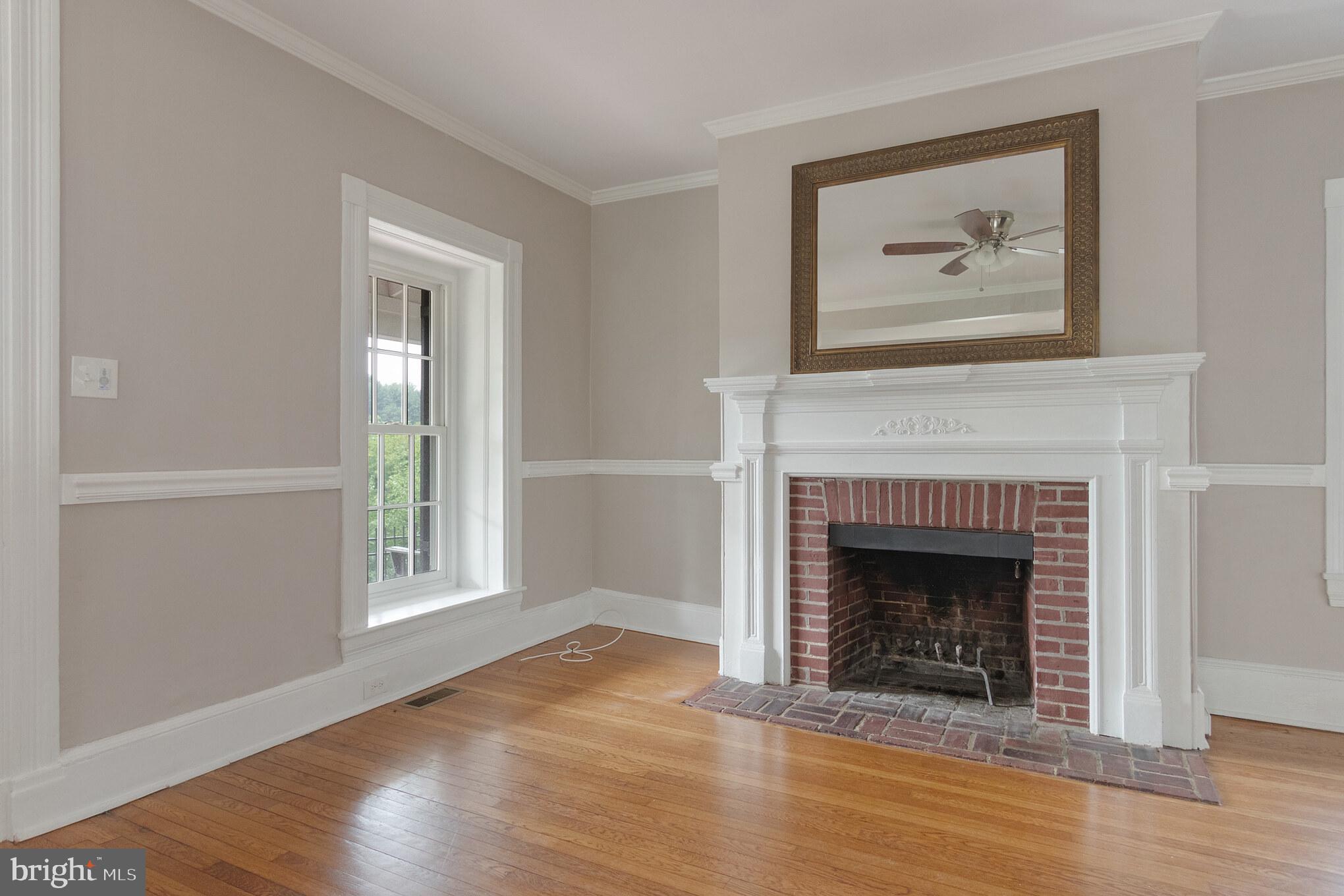 300 Ravenscliff Drive Springfield, PA 19064 - Photo 5 of 45 LIVING ROOM WOOD BURNING FIREPLACE