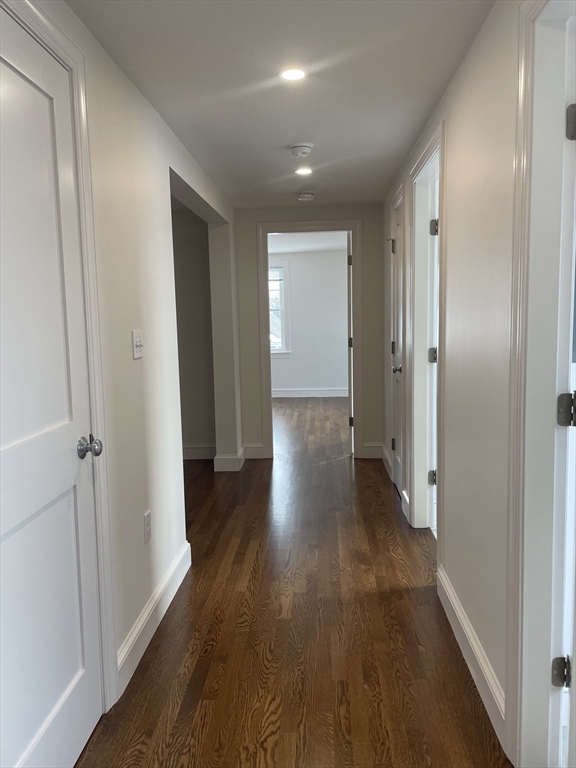 29 Crescent Road, Unit 29 Belmont, MA 02478 - Photo 16 of 21 a view of a hallway with wooden floor