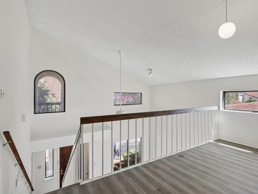 531 Ranch Trail, Unit 157 Irving, TX 75063 - Photo 15 of 21 a view of staircase with wooden floor