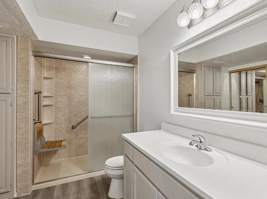 531 Ranch Trail, Unit 157 Irving, TX 75063 - Photo 8 of 21 a bathroom with a sink toilet and shower