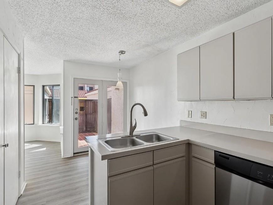 531 Ranch Trail, Unit 157 Irving, TX 75063 - Photo 9 of 21 a kitchen with a sink and cabinets