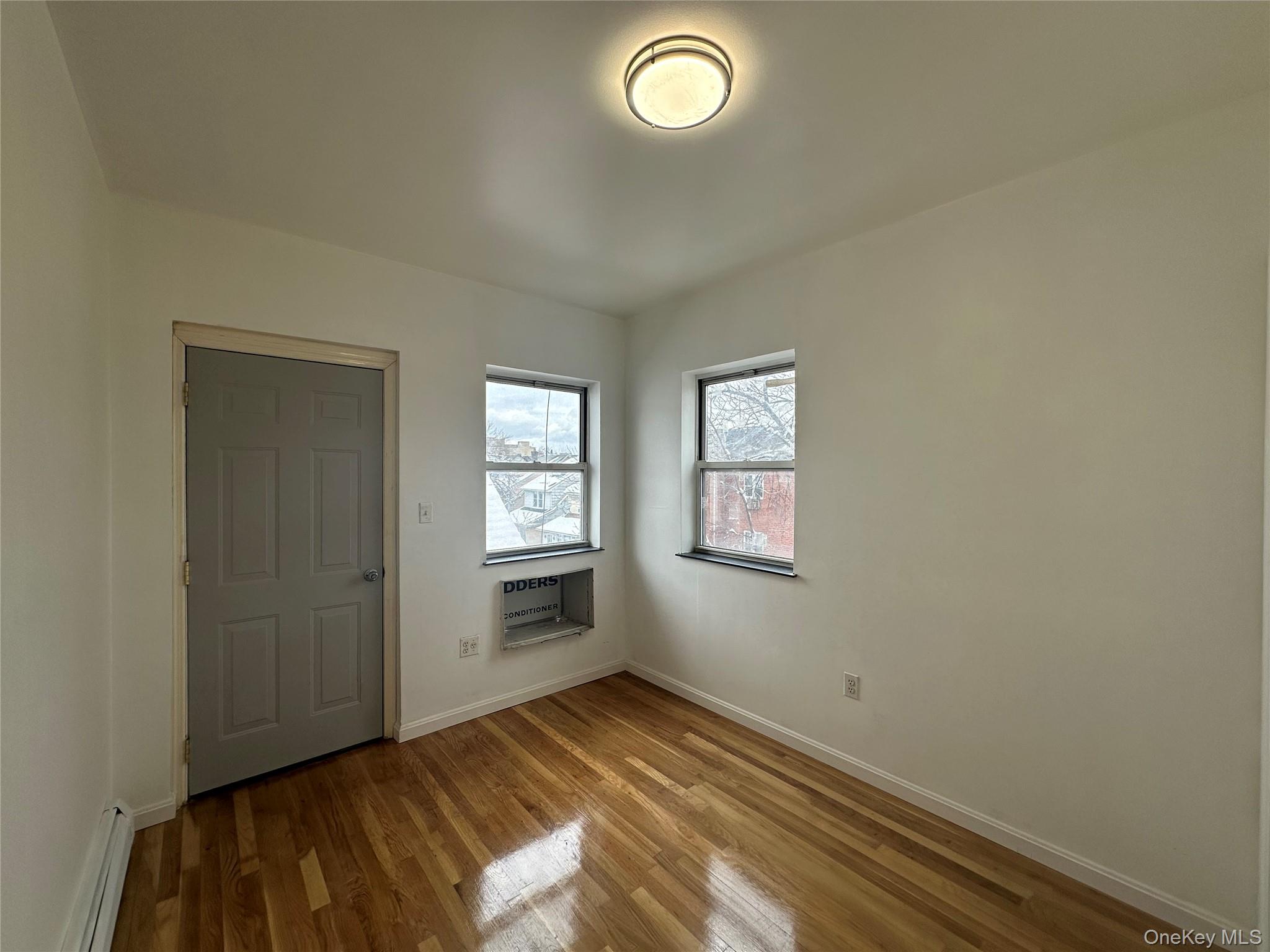 85-45 Britton Avenue Queens, NY 11373 - Photo 12 of 19 an empty room with windows
