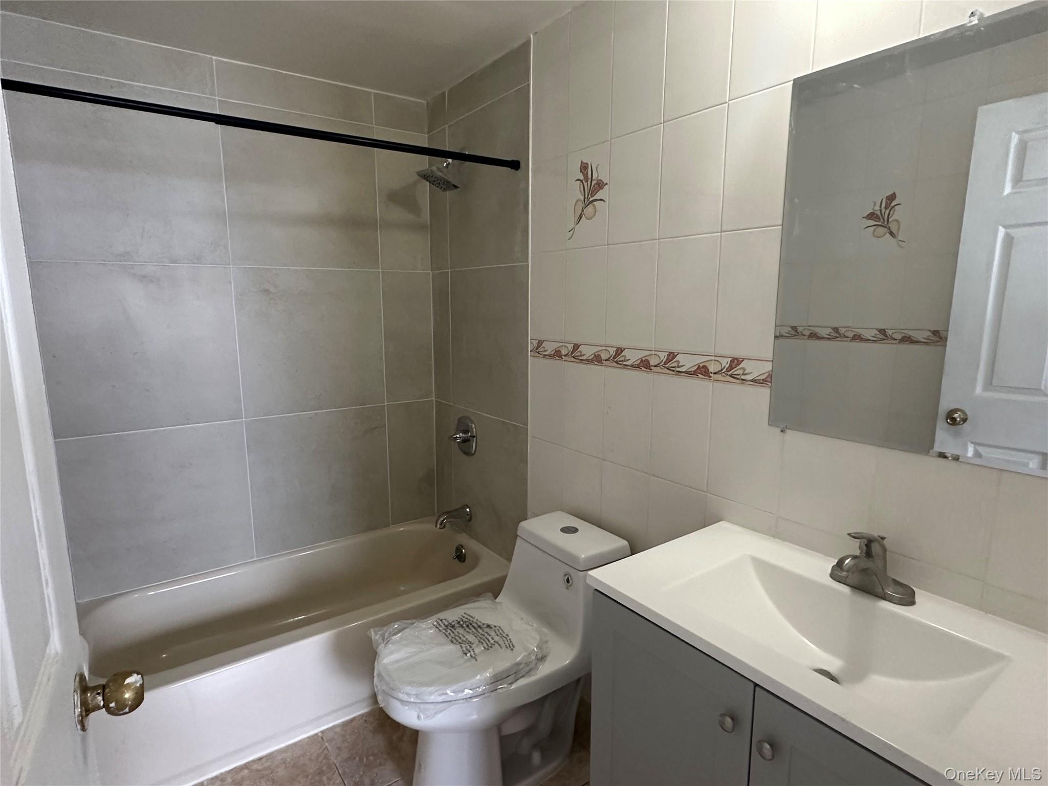 85-45 Britton Avenue Queens, NY 11373 - Photo 13 of 19 a bathroom with a sink toilet and shower