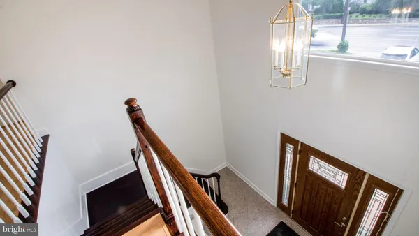 a view of an empty room with stairs